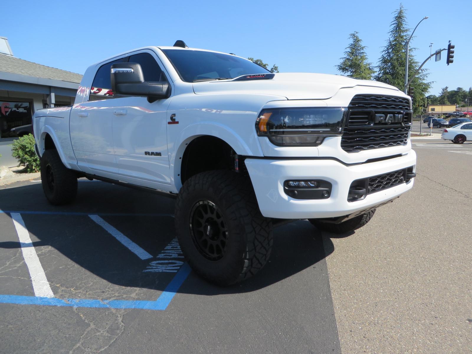 2023 White /BLACK RAM 3500 Limited Mega Cab 4WD (3C63R3PL6PG) with an 6.7L L6 OHV 24V TURBO DIESEL engine, 6A transmission, located at 2630 Grass Valley Highway, Auburn, CA, 95603, (530) 508-5100, 38.937893, -121.095482 - Limited Ram 3500 just built with a BDS 4" long arm suspension system, Fox 2.5 Performance Elite series shocks, Fox ATS steering stabilizer, Carli Suspension rear leaf spring Add- A-Packs, 37" Nitto Ridge Grappler tires, 18" Method NV wheels, CJC Offroad Intercooler guard, B&W tow and stow hitch, Bol - Photo #2