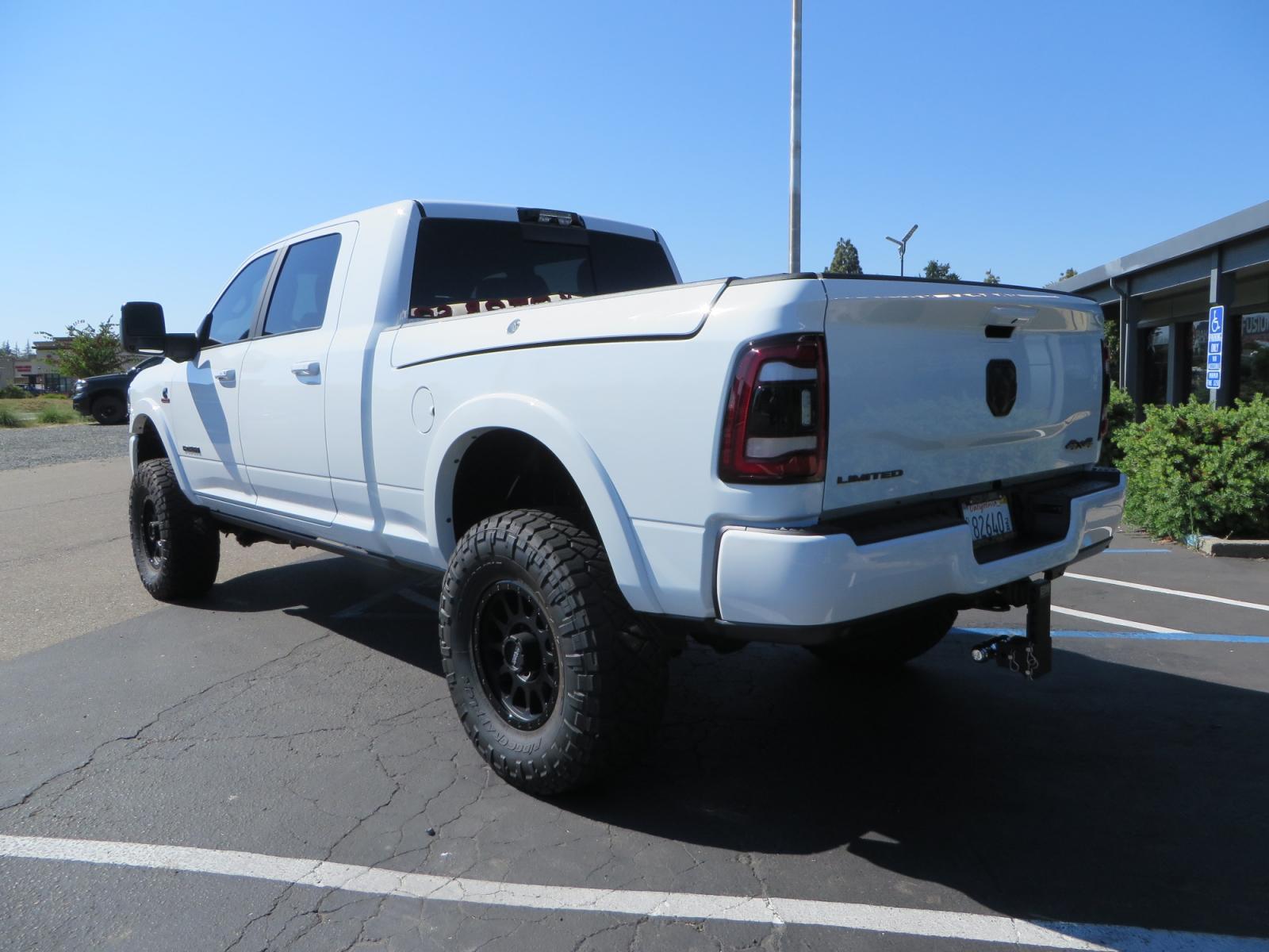 2023 White /BLACK RAM 3500 Limited Mega Cab 4WD (3C63R3PL6PG) with an 6.7L L6 OHV 24V TURBO DIESEL engine, 6A transmission, located at 2630 Grass Valley Highway, Auburn, CA, 95603, (530) 508-5100, 38.937893, -121.095482 - Limited Ram 3500 just built with a BDS 4" long arm suspension system, Fox 2.5 Performance Elite series shocks, Fox ATS steering stabilizer, Carli Suspension rear leaf spring Add- A-Packs, 37" Nitto Ridge Grappler tires, 18" Method NV wheels, CJC Offroad Intercooler guard, B&W tow and stow hitch, Bol - Photo #6