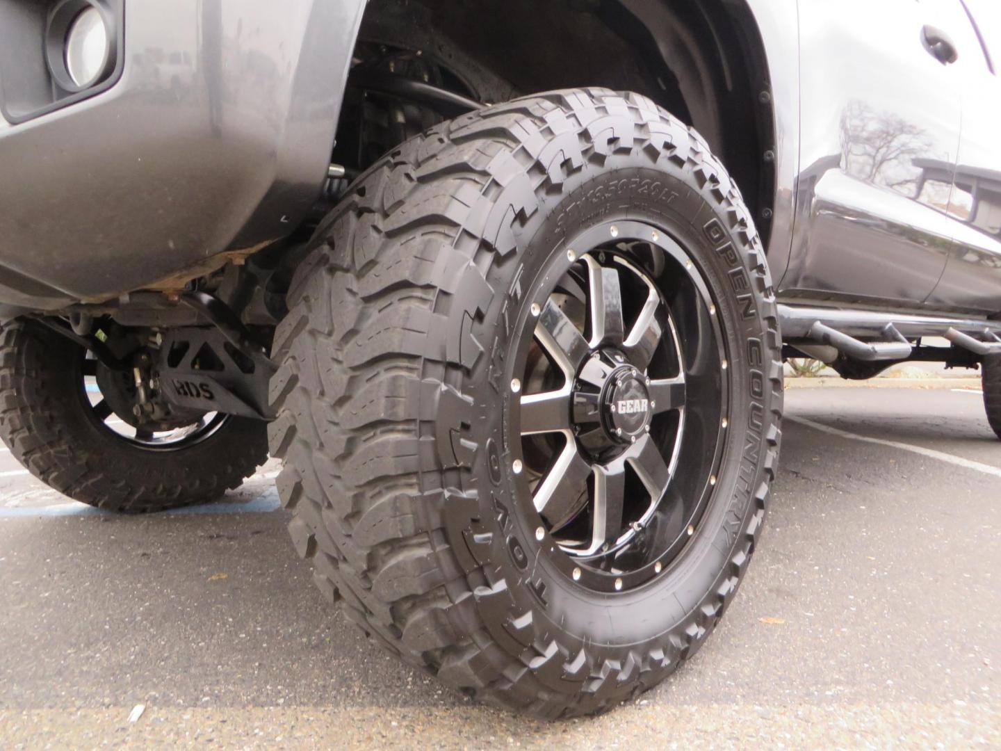 2014 Charcoal Toyota Tundra CrewMax SR5 5.7L V8 CrewMax 4WD (5TFDY5F14EX) with an V8 5.7 Liter engine, Automatic 6-Spd w/Sequential Mode transmission, located at 2630 Grass Valley Highway, Auburn, CA, 95603, (530) 508-5100, 38.937893, -121.095482 - BDS 7" lift kit, Fox remote reservoir coilovers, Fox 2.0 rear shocks, 37" Toyo MT tires, 20" Gear Alloy Big Block wheels, N-Fab running boards, Air Bags, Amp Bed extender, Weathertech floor liners, and window tint. - Photo#9