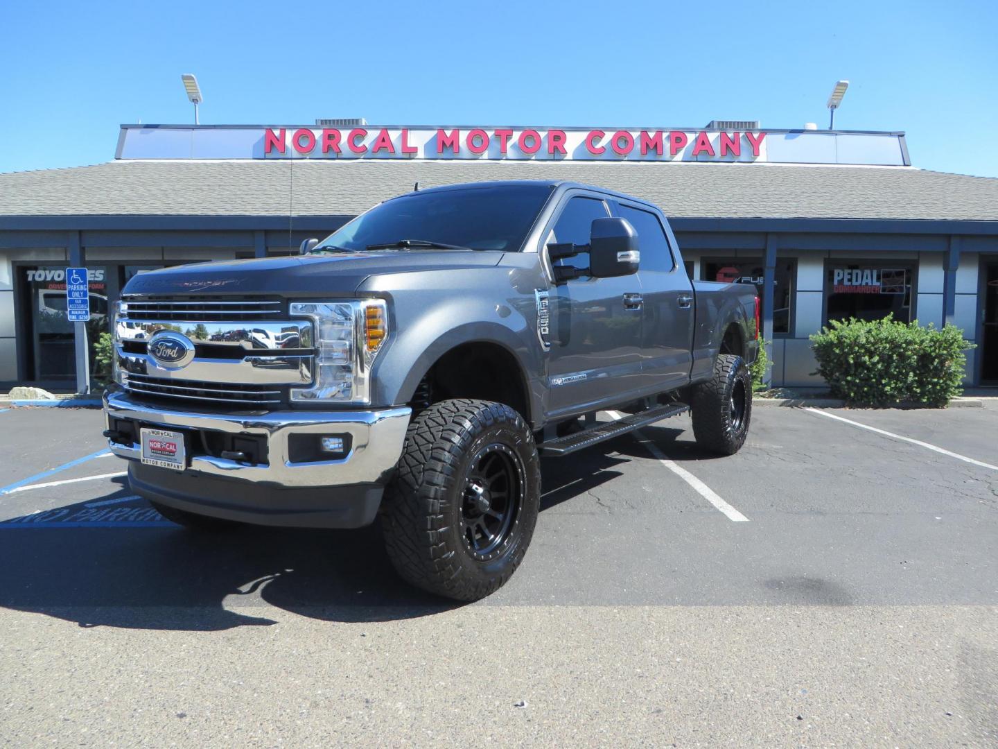 2019 Charcoal /BLACK Ford F250 Super Duty Crew Cab Lariat Crew Cab 4WD (1FT7W2BT0KE) with an V8 Turbo Diesel 6.7 Liter engine, Automatic 6-Spd w/SelectShift and TorqShift-G transmission, located at 2630 Grass Valley Highway, Auburn, CA, 95603, (530) 508-5100, 38.937893, -121.095482 - Features - BDS 4" radius arm suspension system, Fox 2.0 shocks, 37" NItto Ridge Grappler tires, 20" Method NV wheels, and window tint. - Photo#0