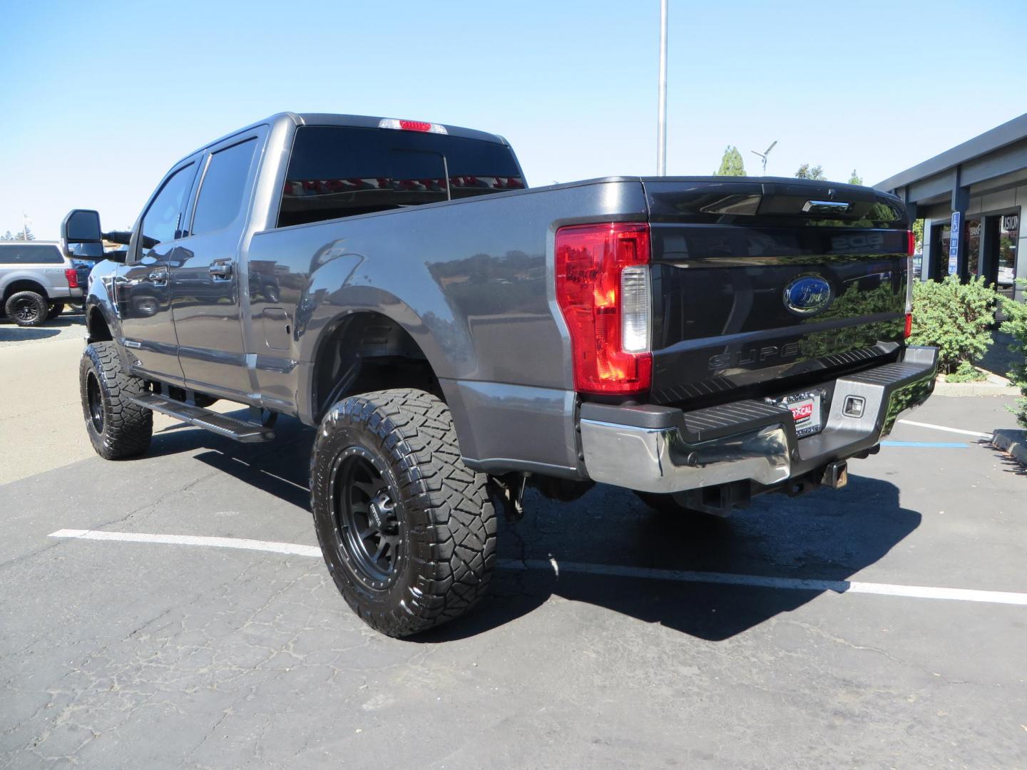 2019 Charcoal /BLACK Ford F250 Super Duty Crew Cab Lariat Crew Cab 4WD (1FT7W2BT0KE) with an V8 Turbo Diesel 6.7 Liter engine, Automatic 6-Spd w/SelectShift and TorqShift-G transmission, located at 2630 Grass Valley Highway, Auburn, CA, 95603, (530) 508-5100, 38.937893, -121.095482 - Features - BDS 4" radius arm suspension system, Fox 2.0 shocks, 37" NItto Ridge Grappler tires, 20" Method NV wheels, and window tint. - Photo#6