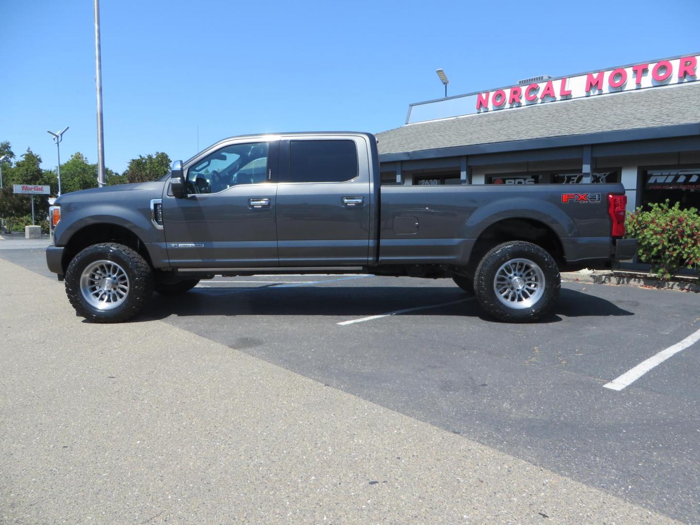 2017 Charcoal Ford F350 Super Duty Crew Cab Platinum Crew Cab Long Bed 4WD (1FT8W3BT5HE) with an V8 Turbo Diesel 6.7L engine, Auto HD 6-Spd SelShft transmission, located at 2630 Grass Valley Highway, Auburn, CA, 95603, (530) 508-5100, 38.937893, -121.095482 - Leveled Long Bed Platinum Superduty sitting on 20" Asanti wheels and Toyo AT3 tires. - Photo#7