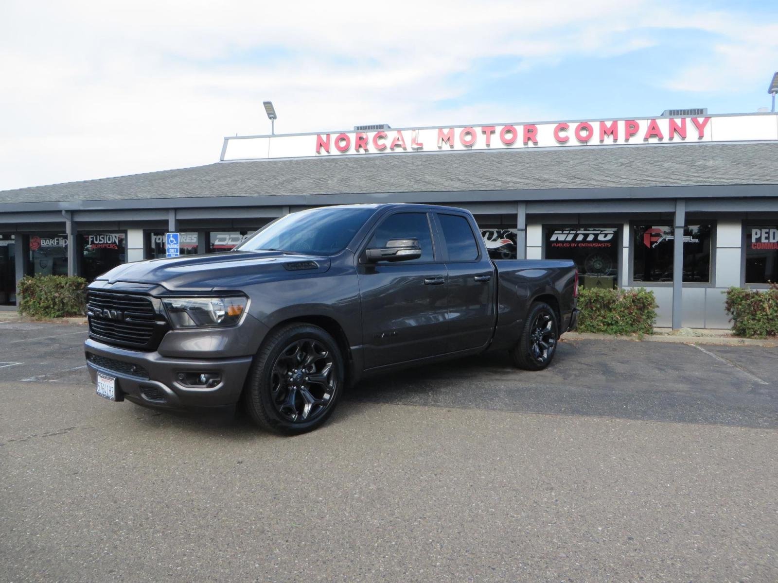 2021 GRANITE CRYSTAL Ram 1500 Quad Cab Big Horn Pickup 4D 6 1/3 ft (1C6RREBT8MN) with an V8 HEMI eTorque 5.7 Liter engine, Automatic 8-Spd transmission, located at 2630 Grass Valley Highway, Auburn, CA, 95603, (530) 508-5100, 38.937893, -121.095482 - Maxtrac 3/1 lowering kit sitting on top of factory 22" wheels and tires and a Magnaflow muffler. - Photo #0