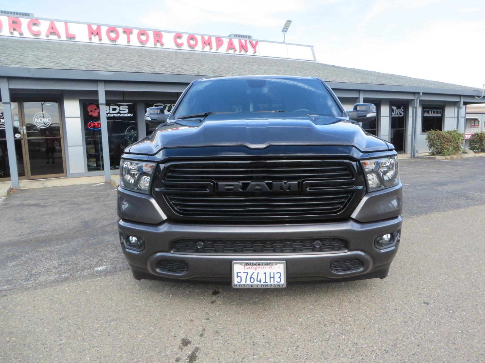 2021 GRANITE CRYSTAL Ram 1500 Quad Cab Big Horn Pickup 4D 6 1/3 ft (1C6RREBT8MN) with an V8 HEMI eTorque 5.7 Liter engine, Automatic 8-Spd transmission, located at 2630 Grass Valley Highway, Auburn, CA, 95603, (530) 508-5100, 38.937893, -121.095482 - Maxtrac 3/1 lowering kit sitting on top of factory 22" wheels and tires and a Magnaflow muffler. - Photo #1