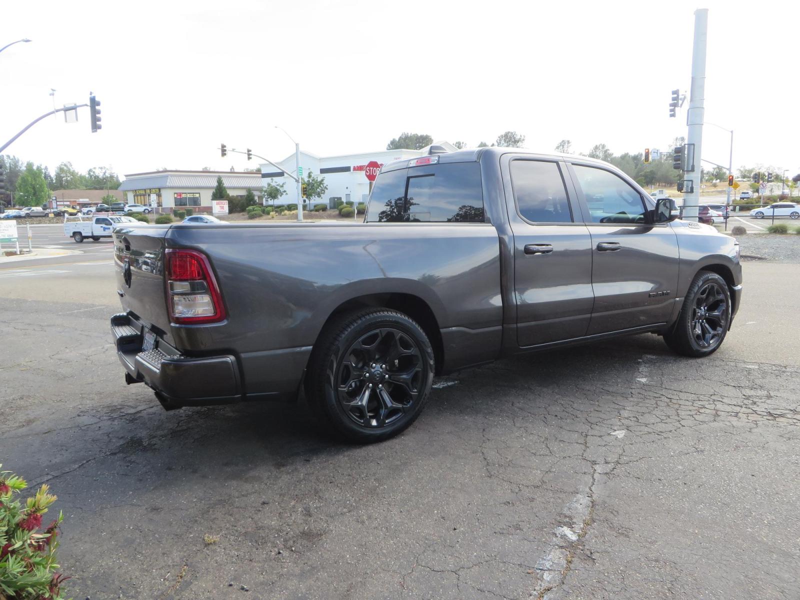2021 GRANITE CRYSTAL Ram 1500 Quad Cab Big Horn Pickup 4D 6 1/3 ft (1C6RREBT8MN) with an V8 HEMI eTorque 5.7 Liter engine, Automatic 8-Spd transmission, located at 2630 Grass Valley Highway, Auburn, CA, 95603, (530) 508-5100, 38.937893, -121.095482 - Maxtrac 3/1 lowering kit sitting on top of factory 22" wheels and tires and a Magnaflow muffler. - Photo #4