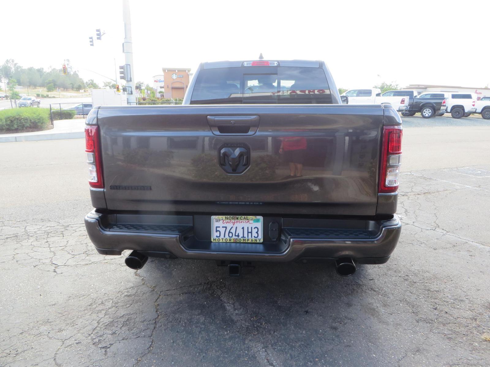2021 GRANITE CRYSTAL Ram 1500 Quad Cab Big Horn Pickup 4D 6 1/3 ft (1C6RREBT8MN) with an V8 HEMI eTorque 5.7 Liter engine, Automatic 8-Spd transmission, located at 2630 Grass Valley Highway, Auburn, CA, 95603, (530) 508-5100, 38.937893, -121.095482 - Maxtrac 3/1 lowering kit sitting on top of factory 22" wheels and tires and a Magnaflow muffler. - Photo #5