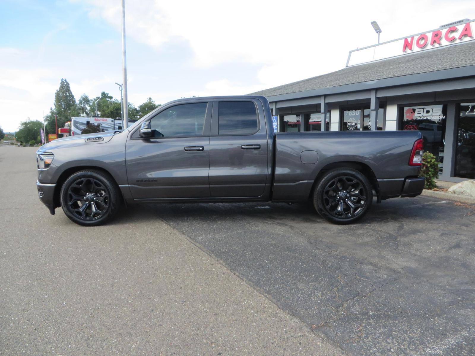 2021 GRANITE CRYSTAL Ram 1500 Quad Cab Big Horn Pickup 4D 6 1/3 ft (1C6RREBT8MN) with an V8 HEMI eTorque 5.7 Liter engine, Automatic 8-Spd transmission, located at 2630 Grass Valley Highway, Auburn, CA, 95603, (530) 508-5100, 38.937893, -121.095482 - Maxtrac 3/1 lowering kit sitting on top of factory 22" wheels and tires and a Magnaflow muffler. - Photo #7