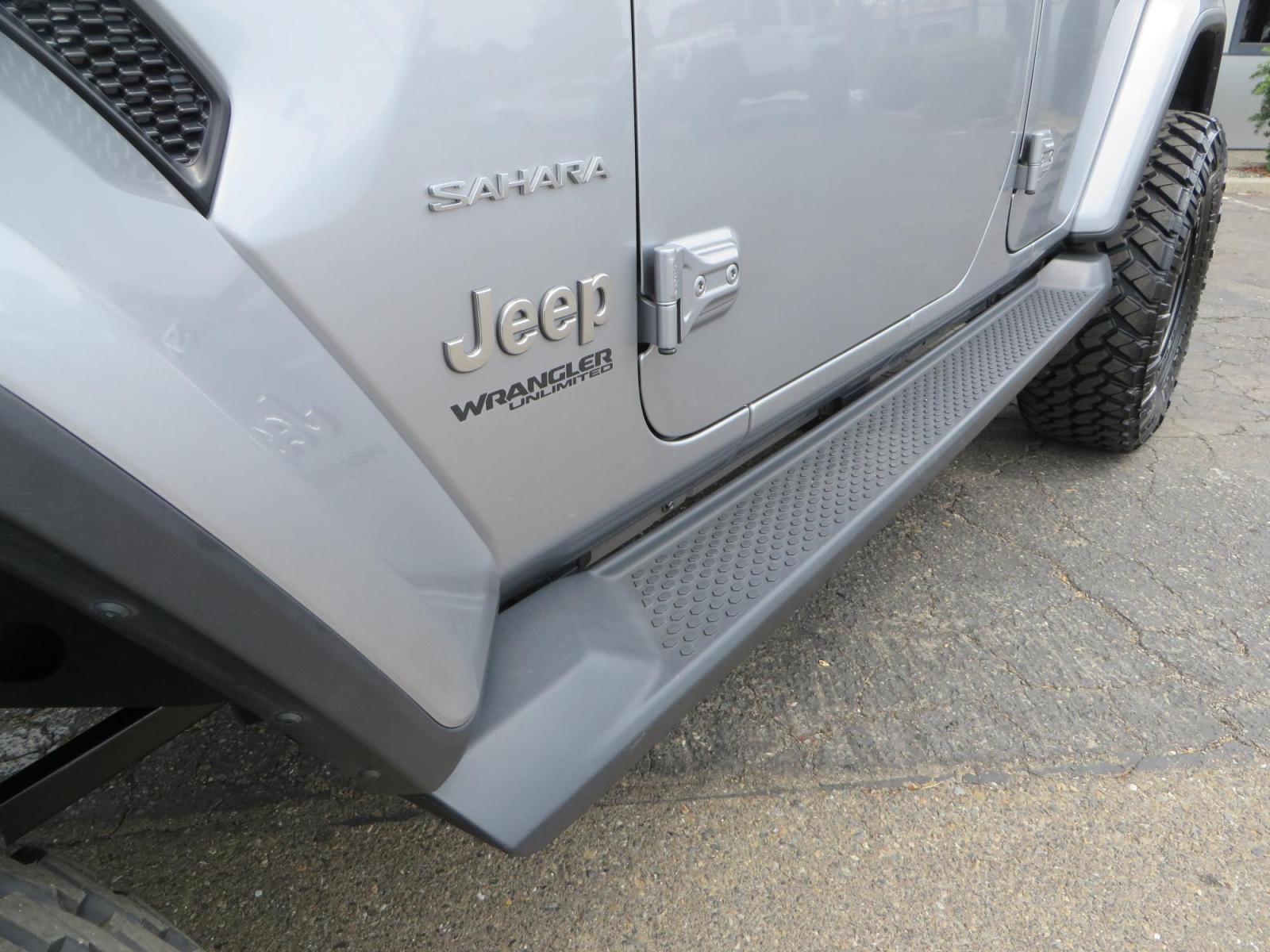 2020 Silver Jeep Wrangler Unlimited Sahara Sport Utility 4D (1C4HJXEN5LW) with an 4-Cyl eTorque Turbo 2.0 Liter engine, Automatic 8-Spd transmission, located at 2630 Grass Valley Highway, Auburn, CA, 95603, (530) 508-5100, 38.937893, -121.095482 - 3" Zone offroad lift kit, 17" KMC 544 wheels wrapped in Nitto Trail Grappler tires. - Photo #10