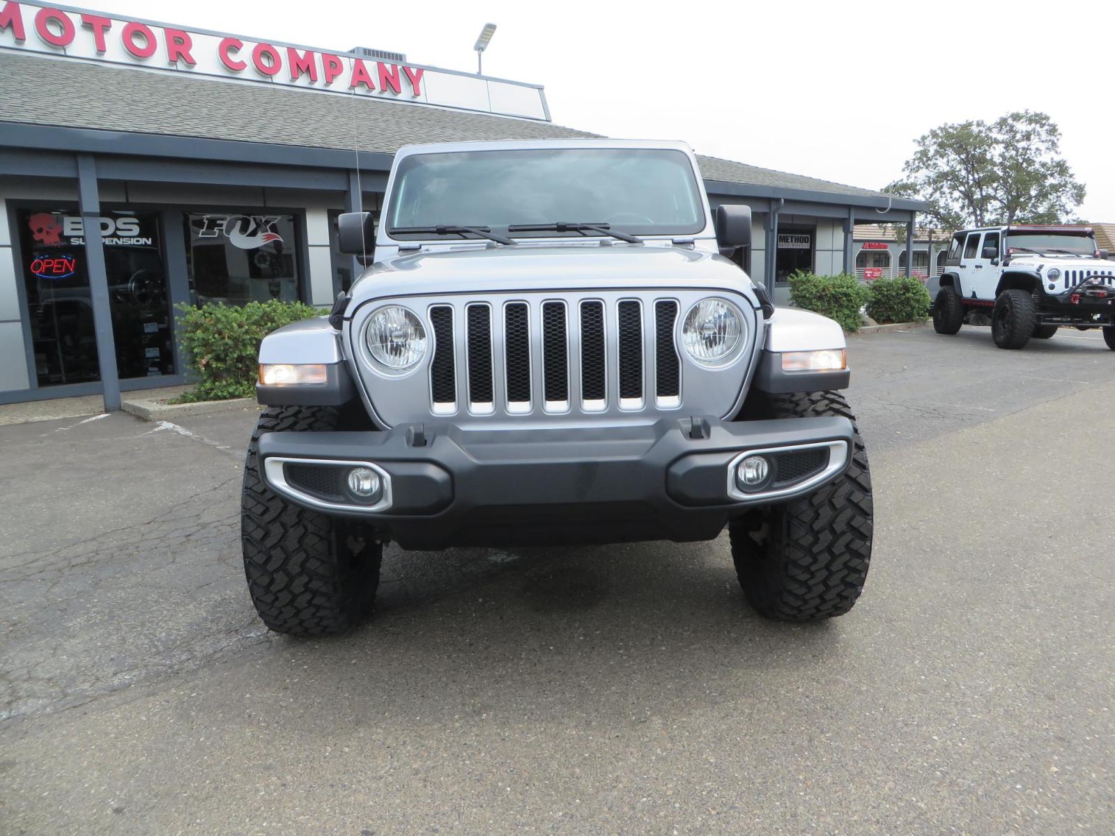 2020 Silver Jeep Wrangler Unlimited Sahara Sport Utility 4D (1C4HJXEN5LW) with an 4-Cyl eTorque Turbo 2.0 Liter engine, Automatic 8-Spd transmission, located at 2630 Grass Valley Highway, Auburn, CA, 95603, (530) 508-5100, 38.937893, -121.095482 - 3" Zone offroad lift kit, 17" KMC 544 wheels wrapped in Nitto Trail Grappler tires. - Photo #1