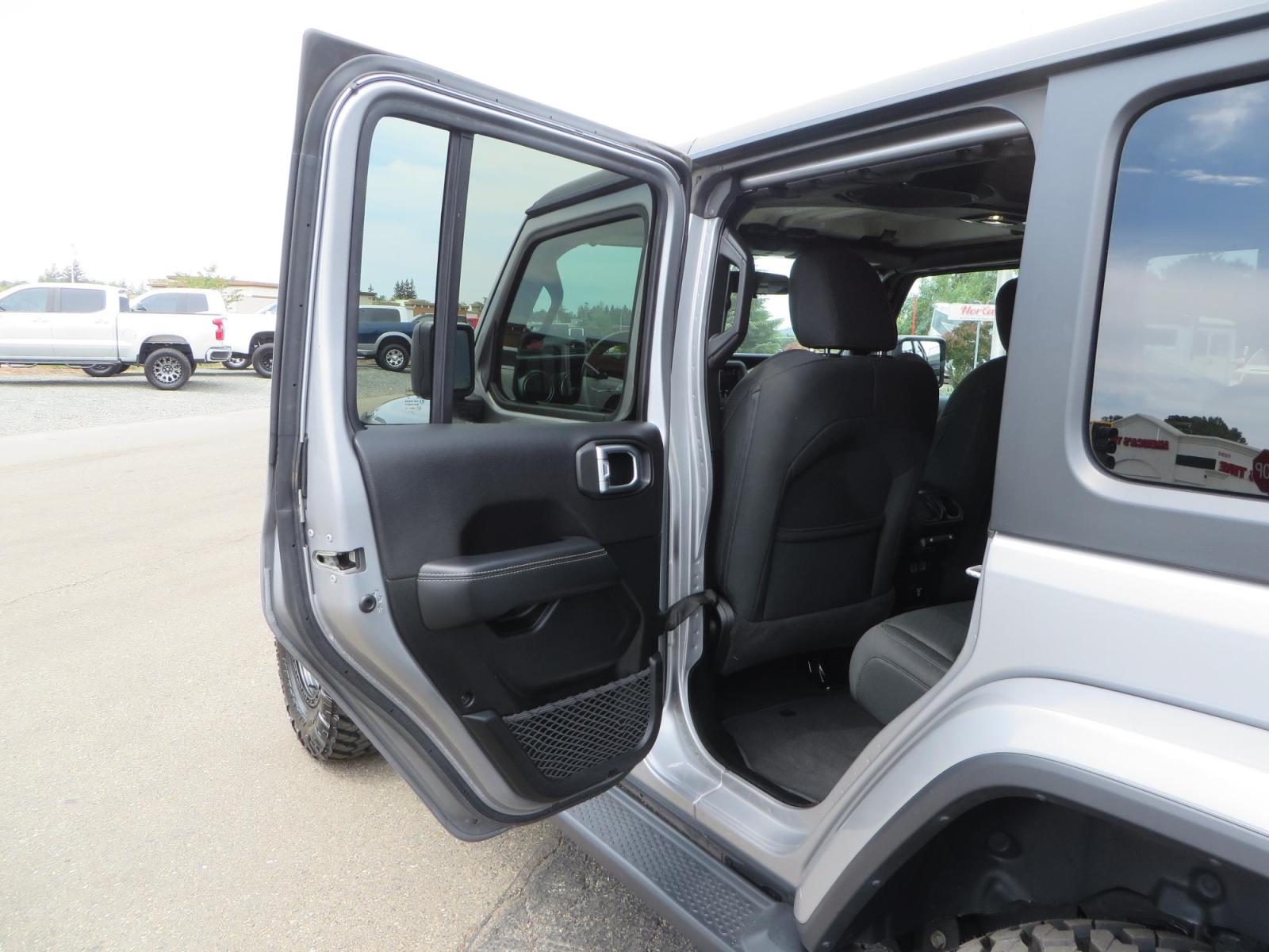 2020 Silver Jeep Wrangler Unlimited Sahara Sport Utility 4D (1C4HJXEN5LW) with an 4-Cyl eTorque Turbo 2.0 Liter engine, Automatic 8-Spd transmission, located at 2630 Grass Valley Highway, Auburn, CA, 95603, (530) 508-5100, 38.937893, -121.095482 - 3" Zone offroad lift kit, 17" KMC 544 wheels wrapped in Nitto Trail Grappler tires. - Photo #29