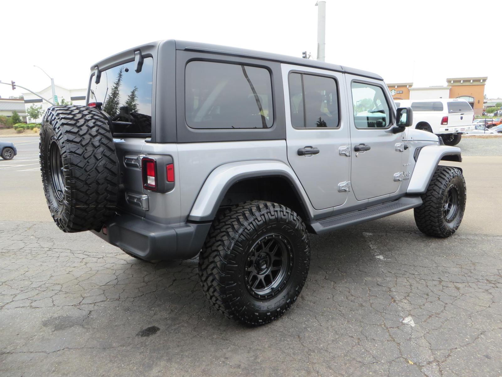 2020 Silver Jeep Wrangler Unlimited Sahara Sport Utility 4D (1C4HJXEN5LW) with an 4-Cyl eTorque Turbo 2.0 Liter engine, Automatic 8-Spd transmission, located at 2630 Grass Valley Highway, Auburn, CA, 95603, (530) 508-5100, 38.937893, -121.095482 - 3" Zone offroad lift kit, 17" KMC 544 wheels wrapped in Nitto Trail Grappler tires. - Photo #4