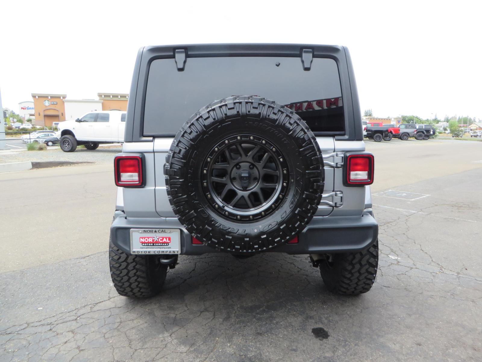 2020 Silver Jeep Wrangler Unlimited Sahara Sport Utility 4D (1C4HJXEN5LW) with an 4-Cyl eTorque Turbo 2.0 Liter engine, Automatic 8-Spd transmission, located at 2630 Grass Valley Highway, Auburn, CA, 95603, (530) 508-5100, 38.937893, -121.095482 - 3" Zone offroad lift kit, 17" KMC 544 wheels wrapped in Nitto Trail Grappler tires. - Photo #5