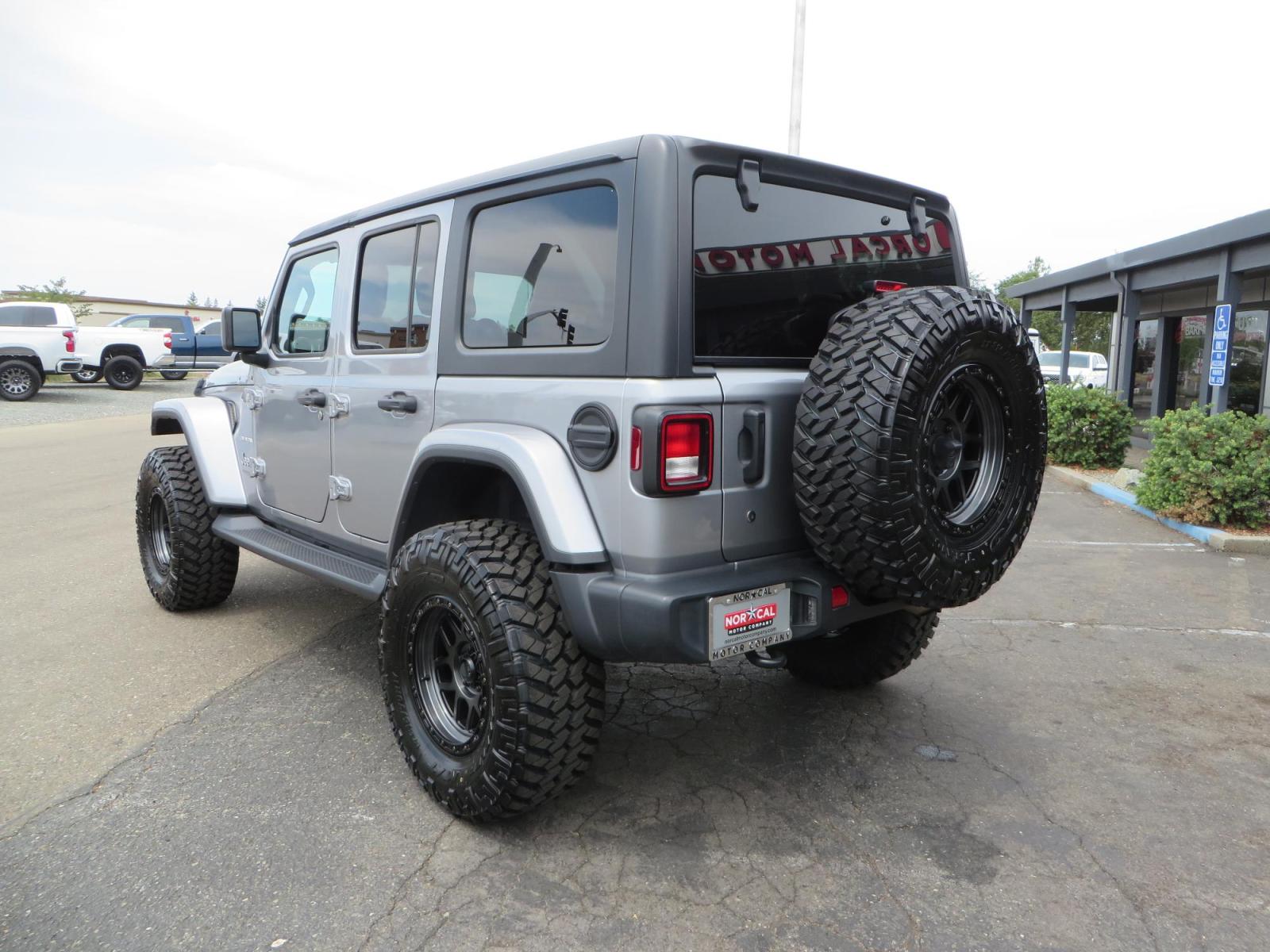 2020 Silver Jeep Wrangler Unlimited Sahara Sport Utility 4D (1C4HJXEN5LW) with an 4-Cyl eTorque Turbo 2.0 Liter engine, Automatic 8-Spd transmission, located at 2630 Grass Valley Highway, Auburn, CA, 95603, (530) 508-5100, 38.937893, -121.095482 - 3" Zone offroad lift kit, 17" KMC 544 wheels wrapped in Nitto Trail Grappler tires. - Photo #6
