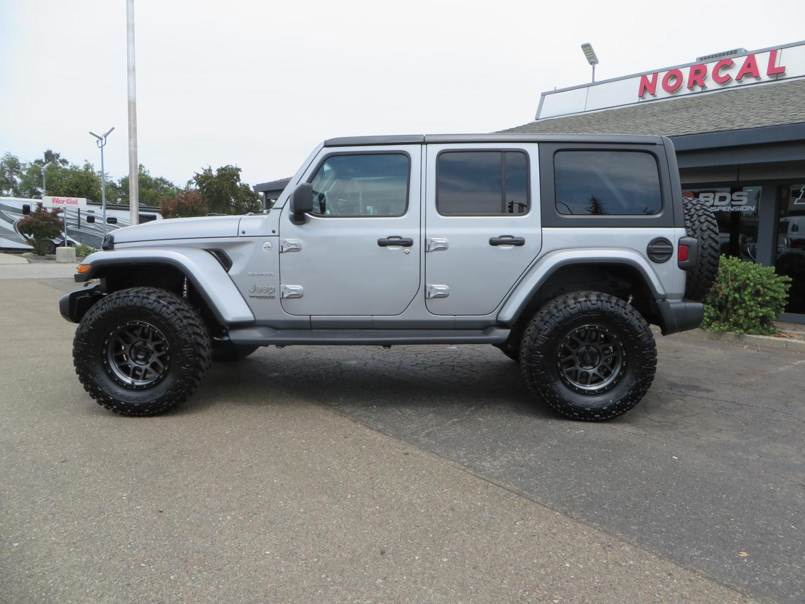2020 Silver Jeep Wrangler Unlimited Sahara Sport Utility 4D (1C4HJXEN5LW) with an 4-Cyl eTorque Turbo 2.0 Liter engine, Automatic 8-Spd transmission, located at 2630 Grass Valley Highway, Auburn, CA, 95603, (530) 508-5100, 38.937893, -121.095482 - 3" Zone offroad lift kit, 17" KMC 544 wheels wrapped in Nitto Trail Grappler tires. - Photo #7