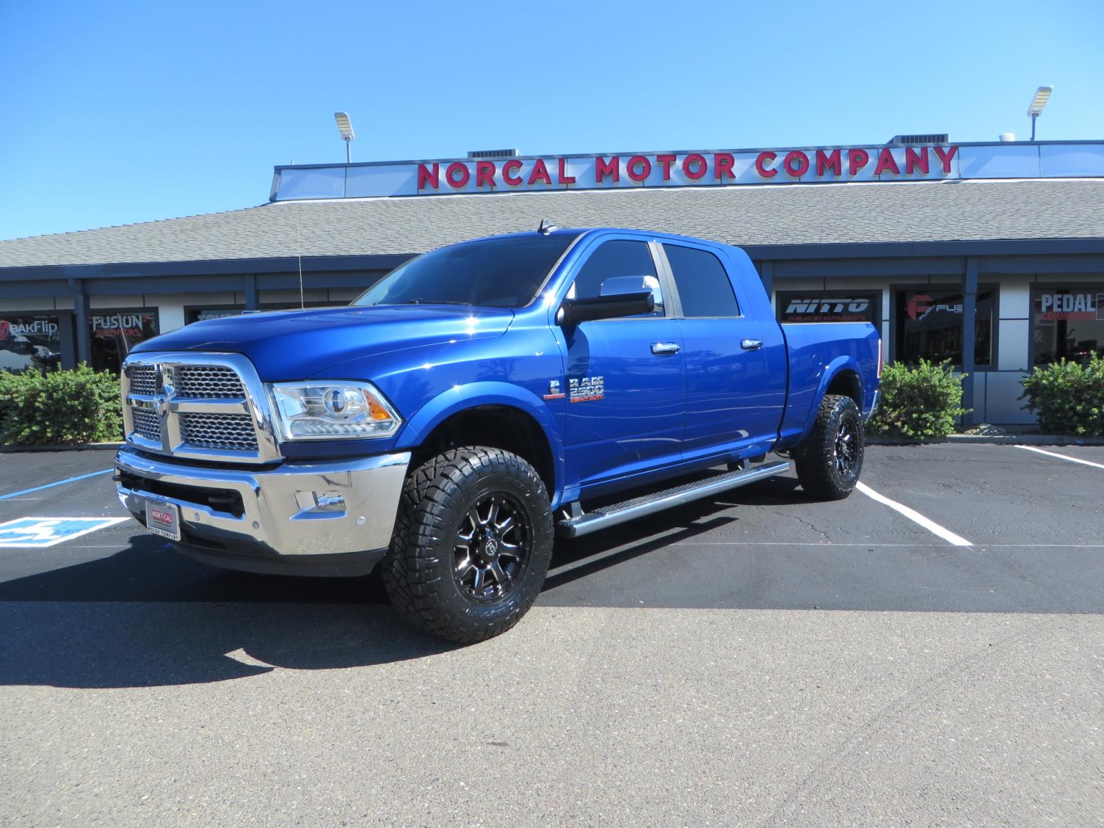 2016 Blue Ram 2500 Mega Cab Laramie Pickup 4D 6 1/3 ft (3C6UR5NL6GG) with an 6-Cyl Turbo Dsl 6.7L engine, Automatic 6-Spd transmission, located at 2630 Grass Valley Highway, Auburn, CA, 95603, (530) 508-5100, 38.937893, -121.095482 - Beautiful Ram with a new set of 18" Black Rhino Sierra wheels wrapped in Nitto Ridge Grappler tires as well as window tint. - Photo #0