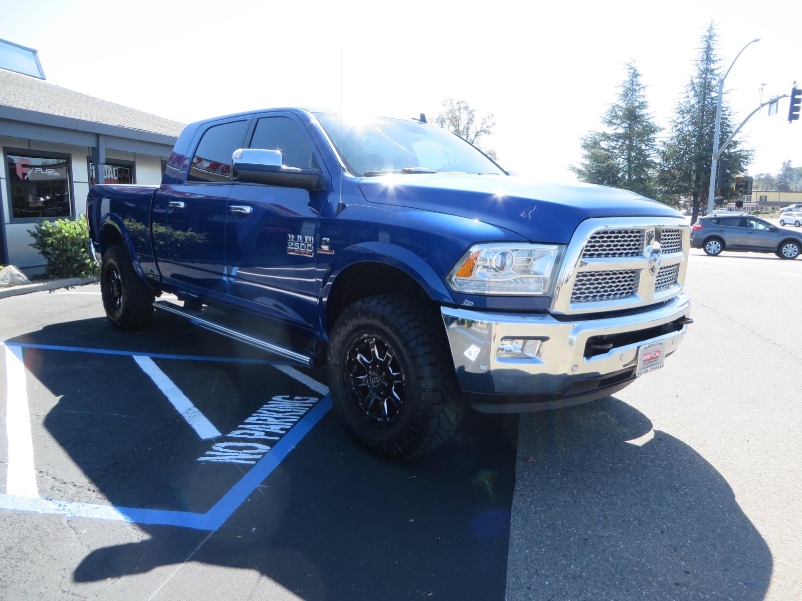 2016 Blue Ram 2500 Mega Cab Laramie Pickup 4D 6 1/3 ft (3C6UR5NL6GG) with an 6-Cyl Turbo Dsl 6.7L engine, Automatic 6-Spd transmission, located at 2630 Grass Valley Highway, Auburn, CA, 95603, (530) 508-5100, 38.937893, -121.095482 - Beautiful Ram with a new set of 18" Black Rhino Sierra wheels wrapped in Nitto Ridge Grappler tires as well as window tint. - Photo #2