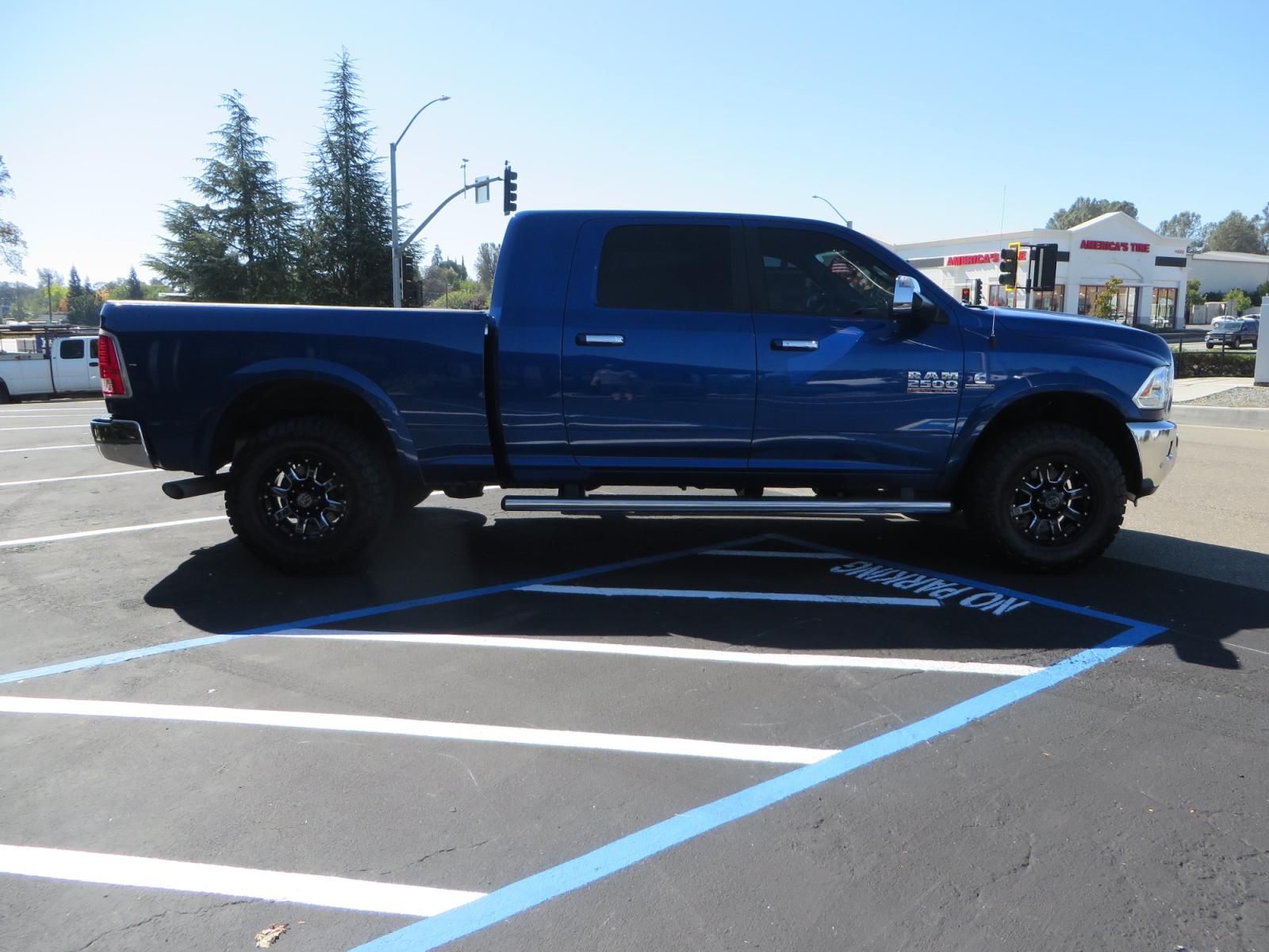 2016 Blue Ram 2500 Mega Cab Laramie Pickup 4D 6 1/3 ft (3C6UR5NL6GG) with an 6-Cyl Turbo Dsl 6.7L engine, Automatic 6-Spd transmission, located at 2630 Grass Valley Highway, Auburn, CA, 95603, (530) 508-5100, 38.937893, -121.095482 - Beautiful Ram with a new set of 18" Black Rhino Sierra wheels wrapped in Nitto Ridge Grappler tires as well as window tint. - Photo #3