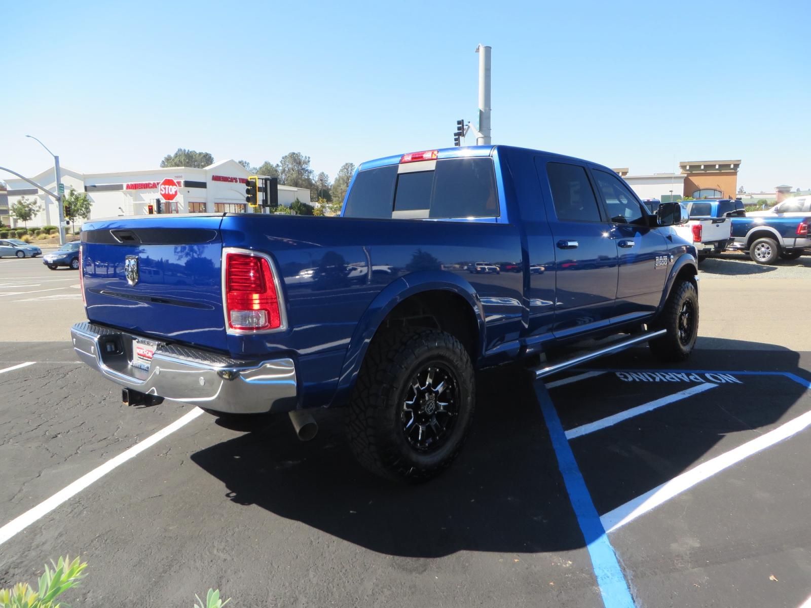 2016 Blue Ram 2500 Mega Cab Laramie Pickup 4D 6 1/3 ft (3C6UR5NL6GG) with an 6-Cyl Turbo Dsl 6.7L engine, Automatic 6-Spd transmission, located at 2630 Grass Valley Highway, Auburn, CA, 95603, (530) 508-5100, 38.937893, -121.095482 - Beautiful Ram with a new set of 18" Black Rhino Sierra wheels wrapped in Nitto Ridge Grappler tires as well as window tint. - Photo #4