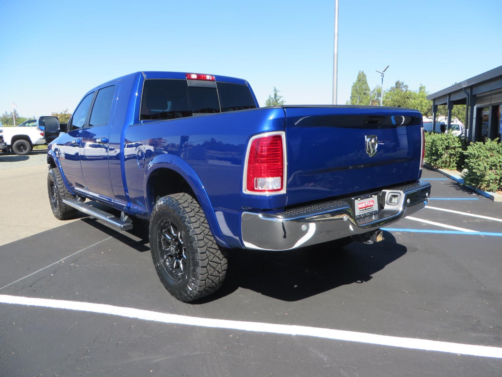 2016 Blue Ram 2500 Mega Cab Laramie Pickup 4D 6 1/3 ft (3C6UR5NL6GG) with an 6-Cyl Turbo Dsl 6.7L engine, Automatic 6-Spd transmission, located at 2630 Grass Valley Highway, Auburn, CA, 95603, (530) 508-5100, 38.937893, -121.095482 - Beautiful Ram with a new set of 18" Black Rhino Sierra wheels wrapped in Nitto Ridge Grappler tires as well as window tint. - Photo #6