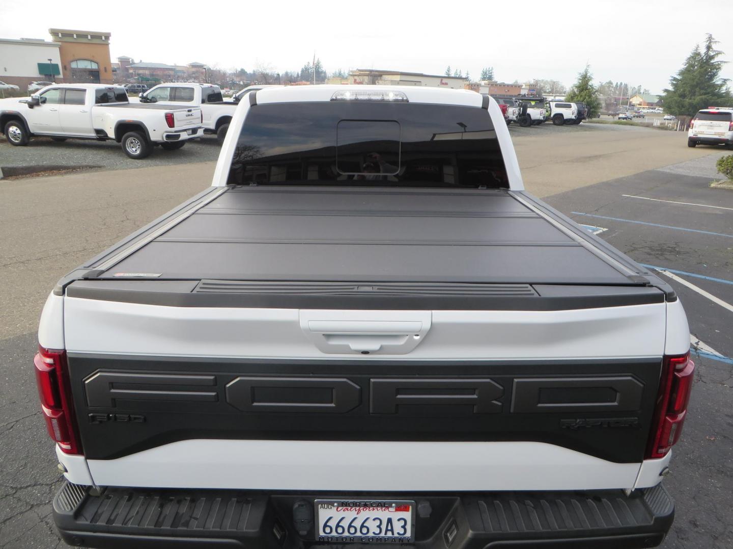 2020 White Ford F150 SuperCrew Cab Raptor Pickup 4D 5 1/2 ft (1FTFW1RG9LF) with an V6 EcoBoost High Output Twin Turbo 3.5 Liter engine, Automatic 10-Spd w/Sport Mode transmission, located at 2630 Grass Valley Highway, Auburn, CA, 95603, (530) 508-5100, 38.937893, -121.095482 - Features 17'' Fuel Rebel wheels, 37'' Goodyear Wrangler Boulder MT tires, Bakflip Tonneau cover, Lightbar behind the grille, Fog pocket led's, Cobb exhaust and cold air intake. - Photo#11