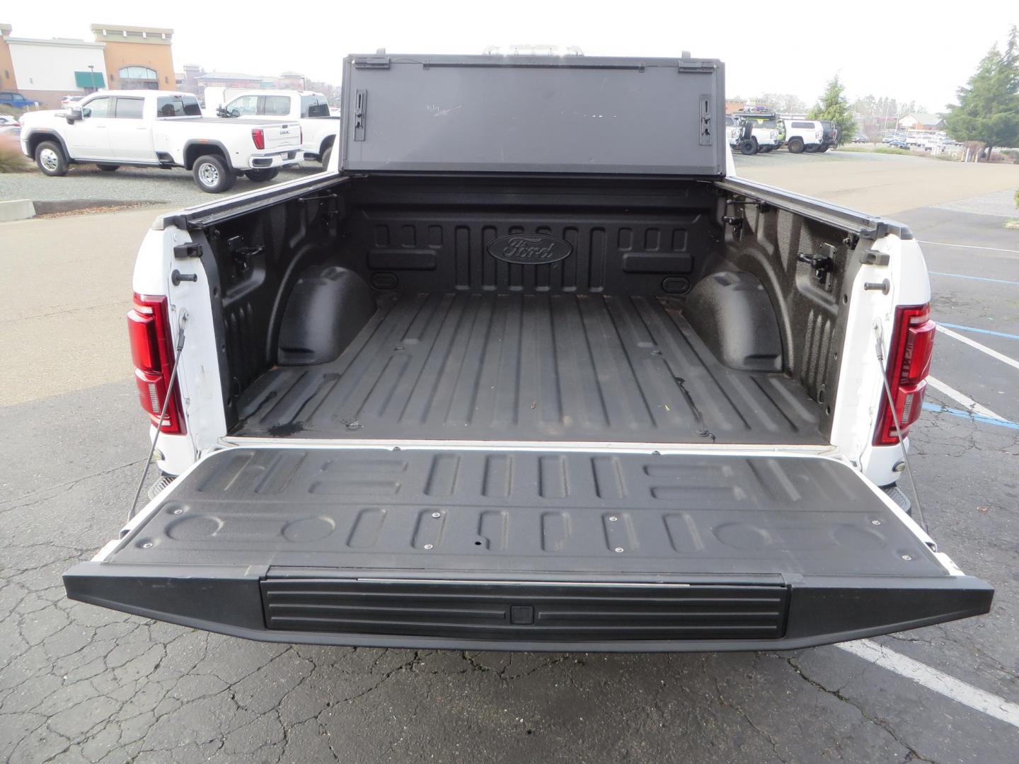 2020 White Ford F150 SuperCrew Cab Raptor Pickup 4D 5 1/2 ft (1FTFW1RG9LF) with an V6 EcoBoost High Output Twin Turbo 3.5 Liter engine, Automatic 10-Spd w/Sport Mode transmission, located at 2630 Grass Valley Highway, Auburn, CA, 95603, (530) 508-5100, 38.937893, -121.095482 - Features 17'' Fuel Rebel wheels, 37'' Goodyear Wrangler Boulder MT tires, Bakflip Tonneau cover, Lightbar behind the grille, Fog pocket led's, Cobb exhaust and cold air intake. - Photo#12