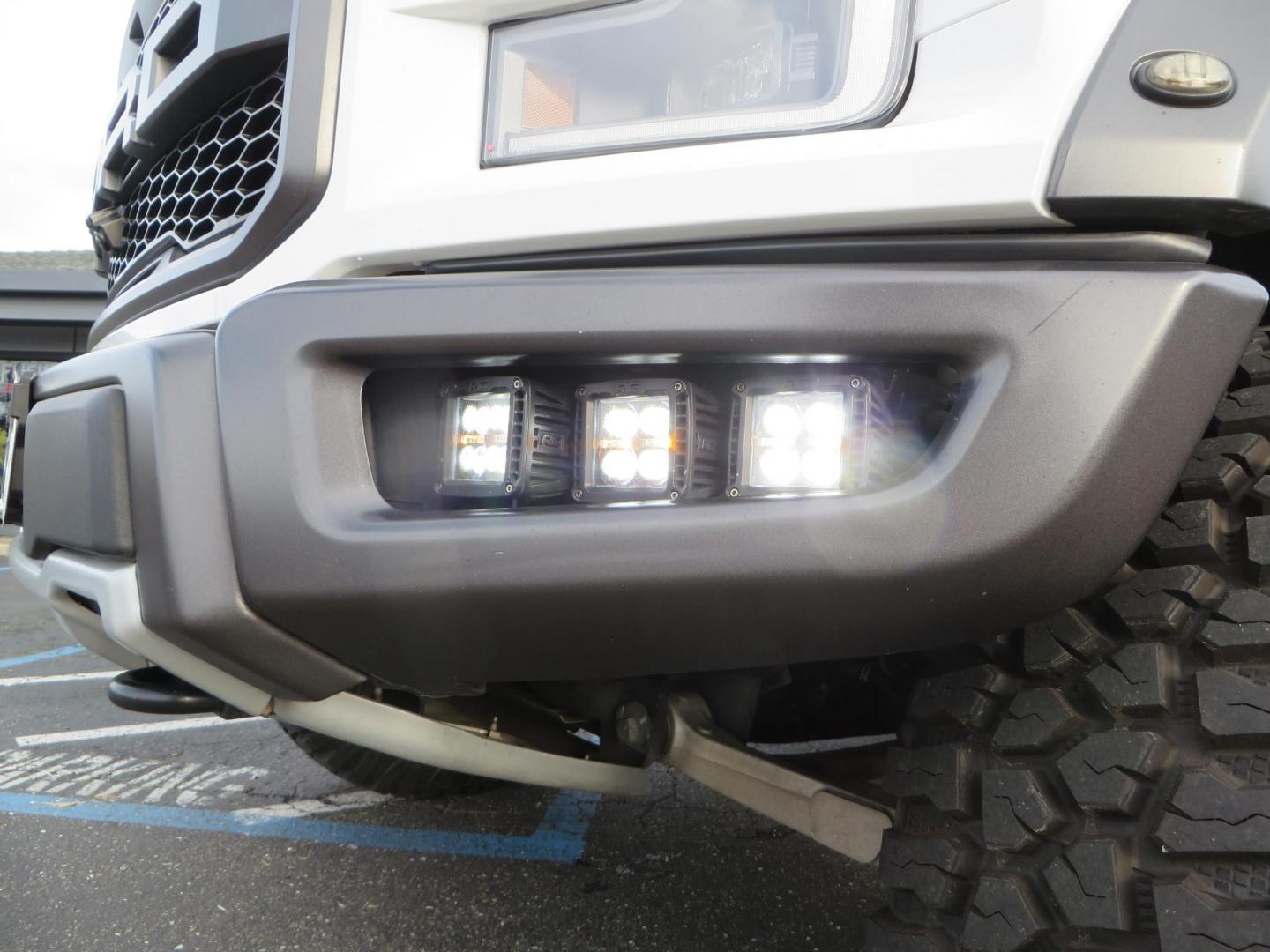 2020 White Ford F150 SuperCrew Cab Raptor Pickup 4D 5 1/2 ft (1FTFW1RG9LF) with an V6 EcoBoost High Output Twin Turbo 3.5 Liter engine, Automatic 10-Spd w/Sport Mode transmission, located at 2630 Grass Valley Highway, Auburn, CA, 95603, (530) 508-5100, 38.937893, -121.095482 - Features 17'' Fuel Rebel wheels, 37'' Goodyear Wrangler Boulder MT tires, Bakflip Tonneau cover, Lightbar behind the grille, Fog pocket led's, Cobb exhaust and cold air intake. - Photo#15