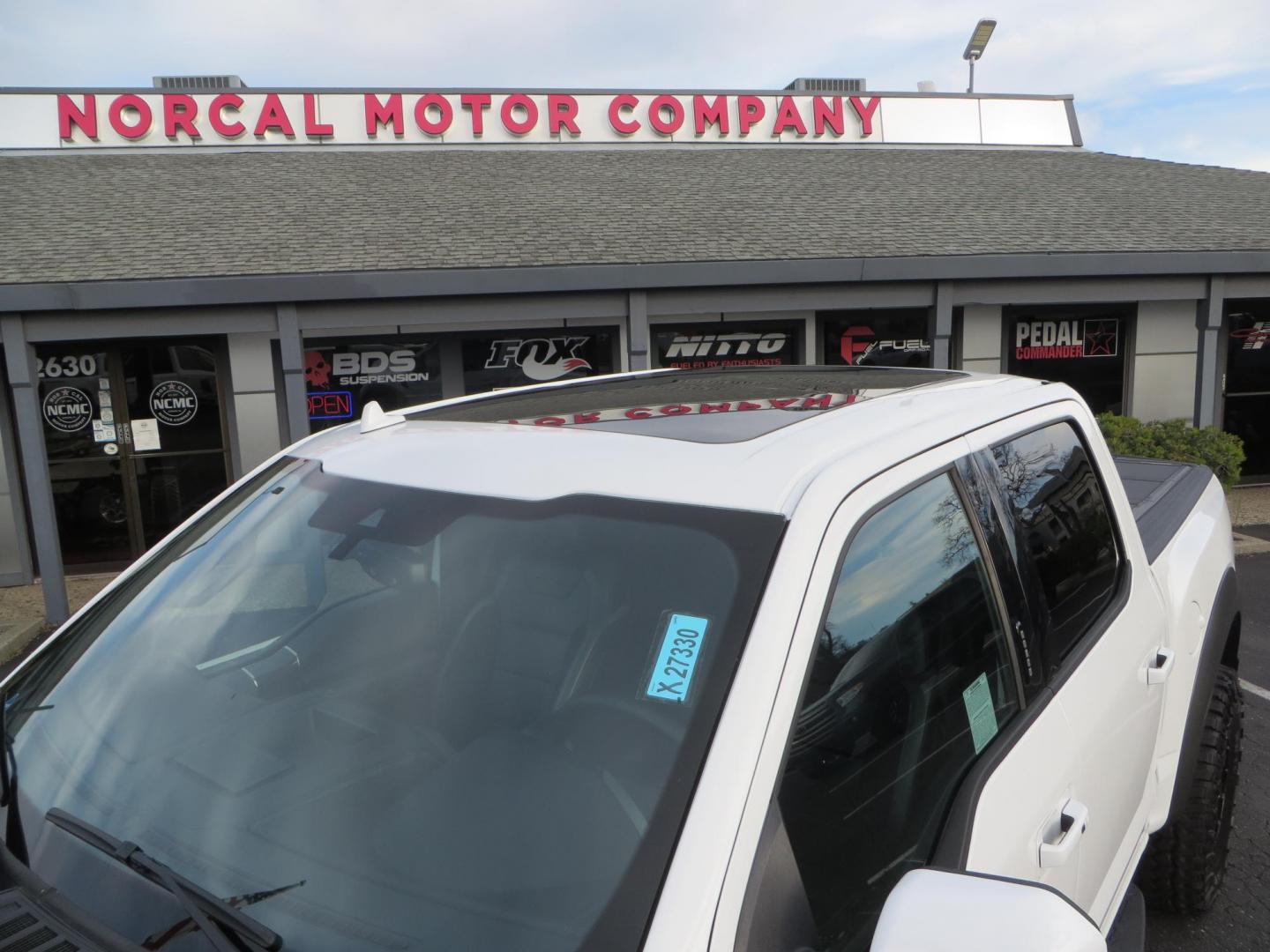 2020 White Ford F150 SuperCrew Cab Raptor Pickup 4D 5 1/2 ft (1FTFW1RG9LF) with an V6 EcoBoost High Output Twin Turbo 3.5 Liter engine, Automatic 10-Spd w/Sport Mode transmission, located at 2630 Grass Valley Highway, Auburn, CA, 95603, (530) 508-5100, 38.937893, -121.095482 - Features 17'' Fuel Rebel wheels, 37'' Goodyear Wrangler Boulder MT tires, Bakflip Tonneau cover, Lightbar behind the grille, Fog pocket led's, Cobb exhaust and cold air intake. - Photo#16