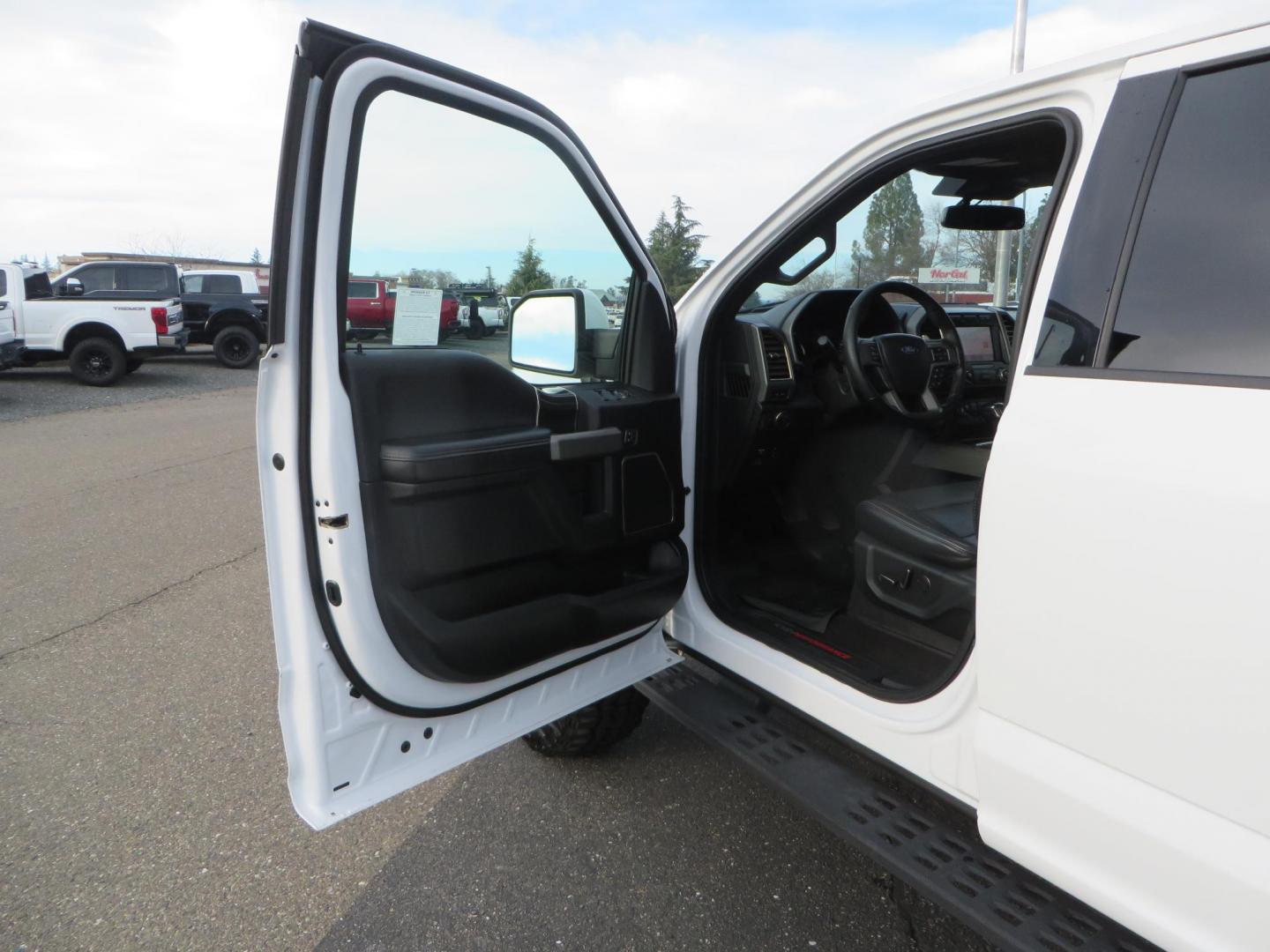 2020 White Ford F150 SuperCrew Cab Raptor Pickup 4D 5 1/2 ft (1FTFW1RG9LF) with an V6 EcoBoost High Output Twin Turbo 3.5 Liter engine, Automatic 10-Spd w/Sport Mode transmission, located at 2630 Grass Valley Highway, Auburn, CA, 95603, (530) 508-5100, 38.937893, -121.095482 - Features 17'' Fuel Rebel wheels, 37'' Goodyear Wrangler Boulder MT tires, Bakflip Tonneau cover, Lightbar behind the grille, Fog pocket led's, Cobb exhaust and cold air intake. - Photo#19