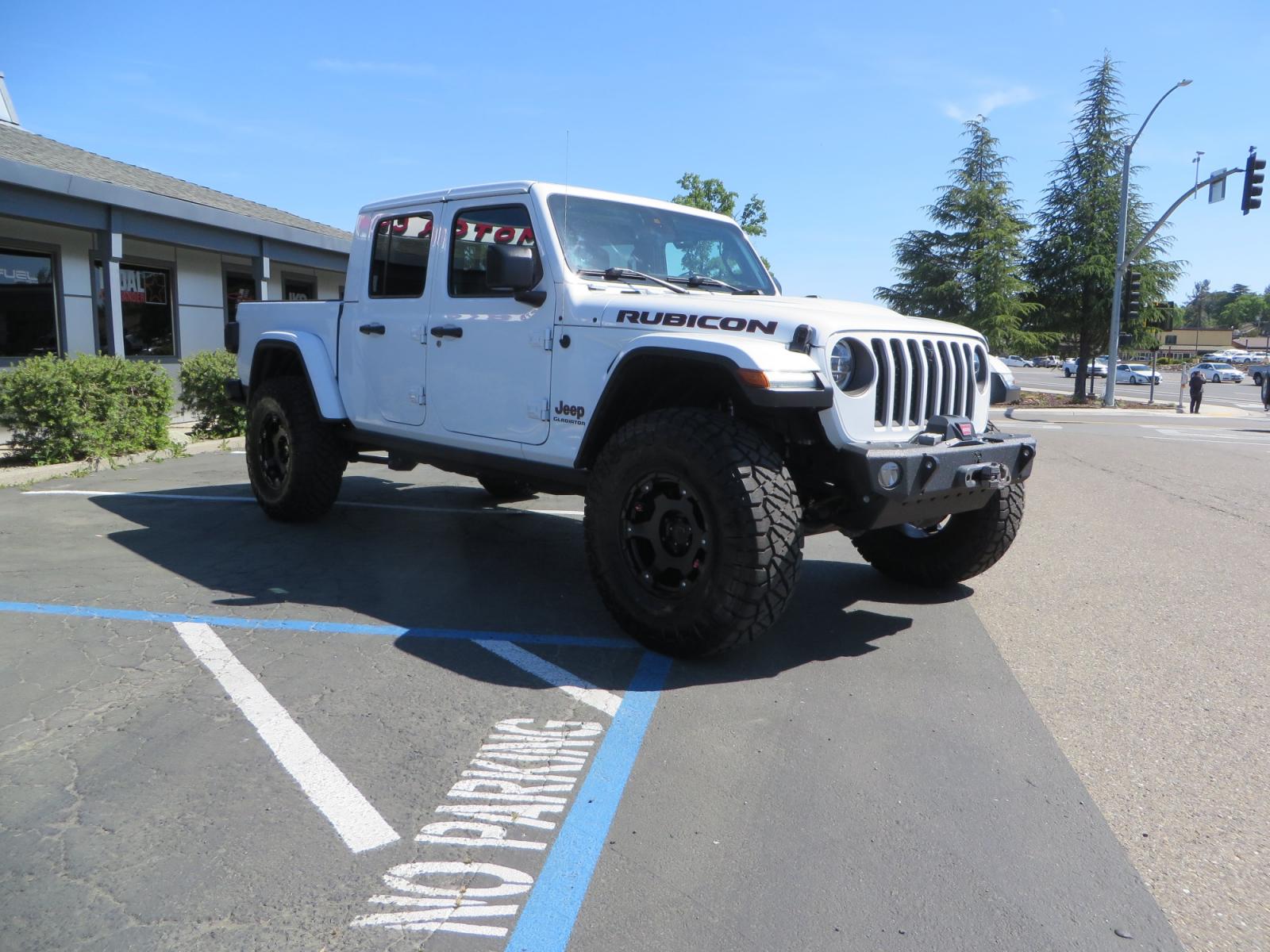 2020 White /BLACK Jeep Gladiator Rubicon (1C6JJTBG3LL) with an 3.6L V6 DOHC 24V engine, 6M transmission, located at 2630 Grass Valley Highway, Auburn, CA, 95603, (530) 508-5100, 38.937893, -121.095482 - Clean Gladiator Rubicon Featuring 17" Teraflex Nomad wheels with quick dump air valves, 37" Nitto Ridge Grappler tires, Next Venture front bumper, Warn 10-S winch, Factor 55 winch fairlead and Ultra hook. - Photo #2