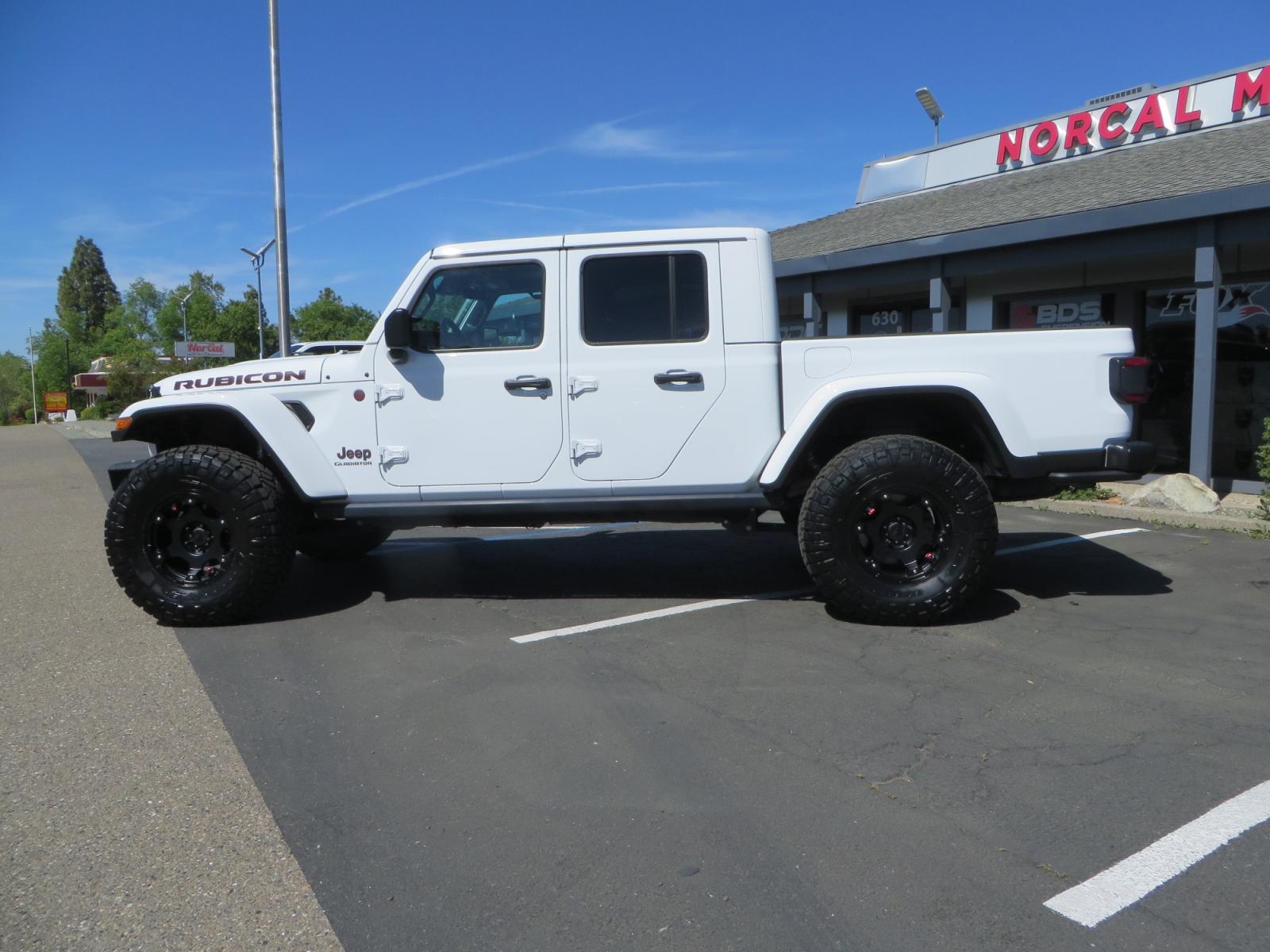 2020 White /BLACK Jeep Gladiator Rubicon (1C6JJTBG3LL) with an 3.6L V6 DOHC 24V engine, 6M transmission, located at 2630 Grass Valley Highway, Auburn, CA, 95603, (530) 508-5100, 38.937893, -121.095482 - Clean Gladiator Rubicon Featuring 17" Teraflex Nomad wheels with quick dump air valves, 37" Nitto Ridge Grappler tires, Next Venture front bumper, Warn 10-S winch, Factor 55 winch fairlead and Ultra hook. - Photo #7