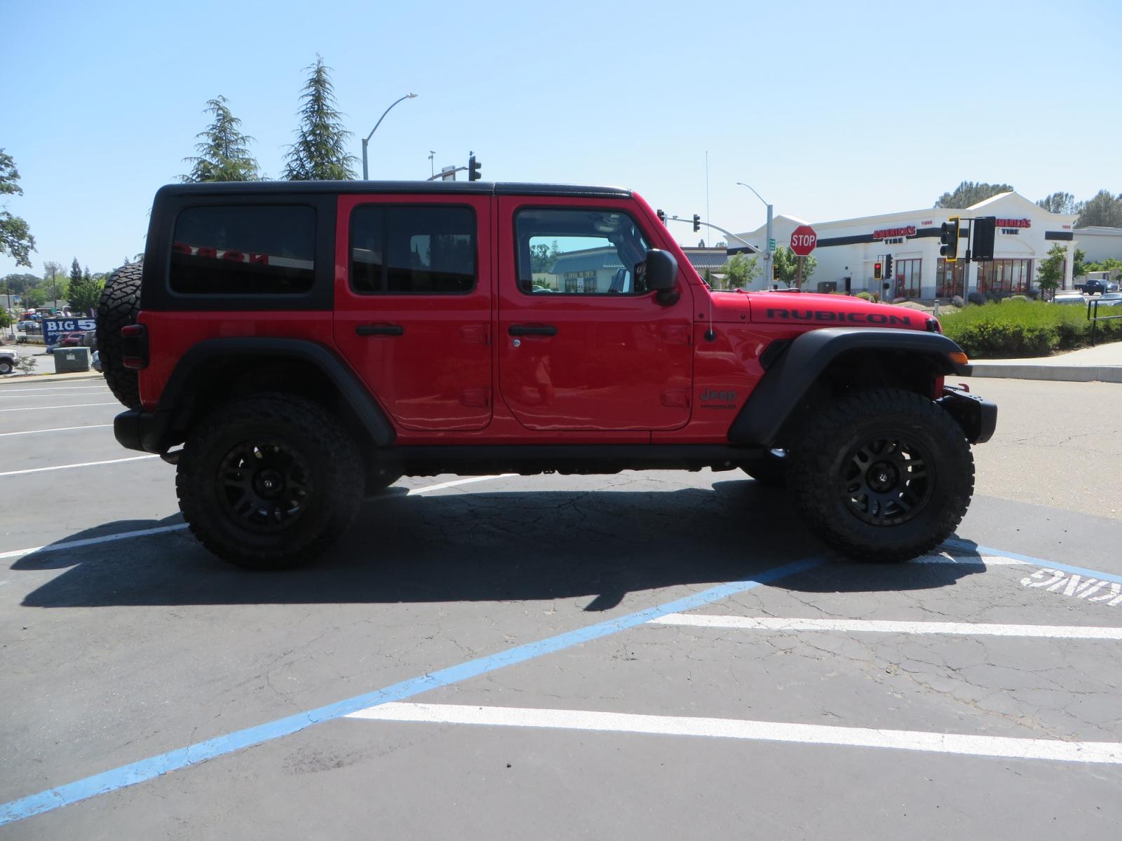 2020 Red /TAN Jeep Wrangler Unlimited Rubicon (1C4HJXFN8LW) with an 2.0L L4 DOHC 16V TURBO engine, 6A transmission, located at 2630 Grass Valley Highway, Auburn, CA, 95603, (530) 508-5100, 38.937893, -121.095482 - Featuring a brand new set of 17" Fuel Recoil wheels and 35" Toyo RT trail tires. - Photo #3