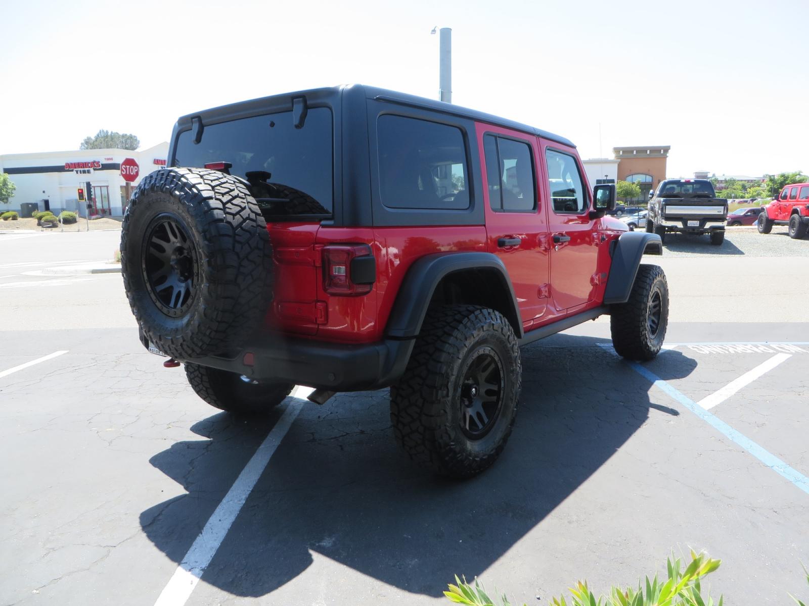 2020 Red /TAN Jeep Wrangler Unlimited Rubicon (1C4HJXFN8LW) with an 2.0L L4 DOHC 16V TURBO engine, 6A transmission, located at 2630 Grass Valley Highway, Auburn, CA, 95603, (530) 508-5100, 38.937893, -121.095482 - Featuring a brand new set of 17" Fuel Recoil wheels and 35" Toyo RT trail tires. - Photo #4