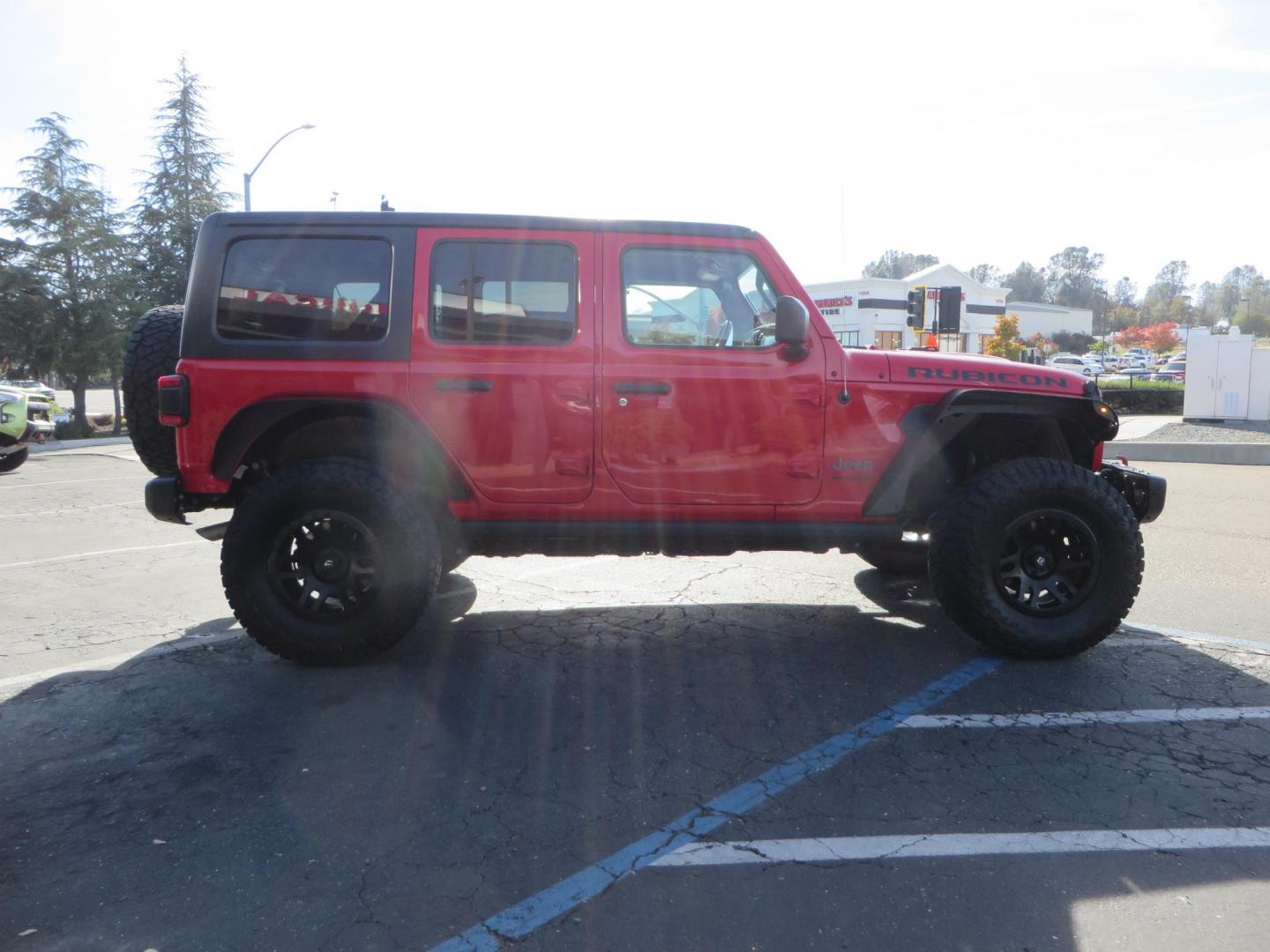 2020 Red /BLACK Jeep Wrangler Unlimited Rubicon (1C4HJXFN8LW) with an 2.0L L4 DOHC 16V TURBO engine, 6A transmission, located at 2630 Grass Valley Highway, Auburn, CA, 95603, (530) 508-5100, 38.937893, -121.095482 - Features - 17'' Fuel Recoil wheels, 35'' Nitto Ridge Grappler tires, Smittybilt XRC Flat fenders, Smittybilt inner fender liners, and new Alea Leather. - Photo#5