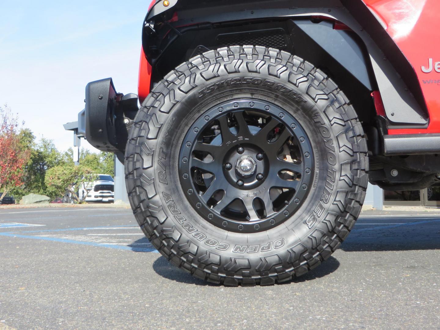 2020 Red /BLACK Jeep Wrangler Unlimited Rubicon (1C4HJXFN8LW) with an 2.0L L4 DOHC 16V TURBO engine, 6A transmission, located at 2630 Grass Valley Highway, Auburn, CA, 95603, (530) 508-5100, 38.937893, -121.095482 - Features - 17'' Fuel Recoil wheels, 35'' Nitto Ridge Grappler tires, Smittybilt XRC Flat fenders, Smittybilt inner fender liners, and new Alea Leather. - Photo#8