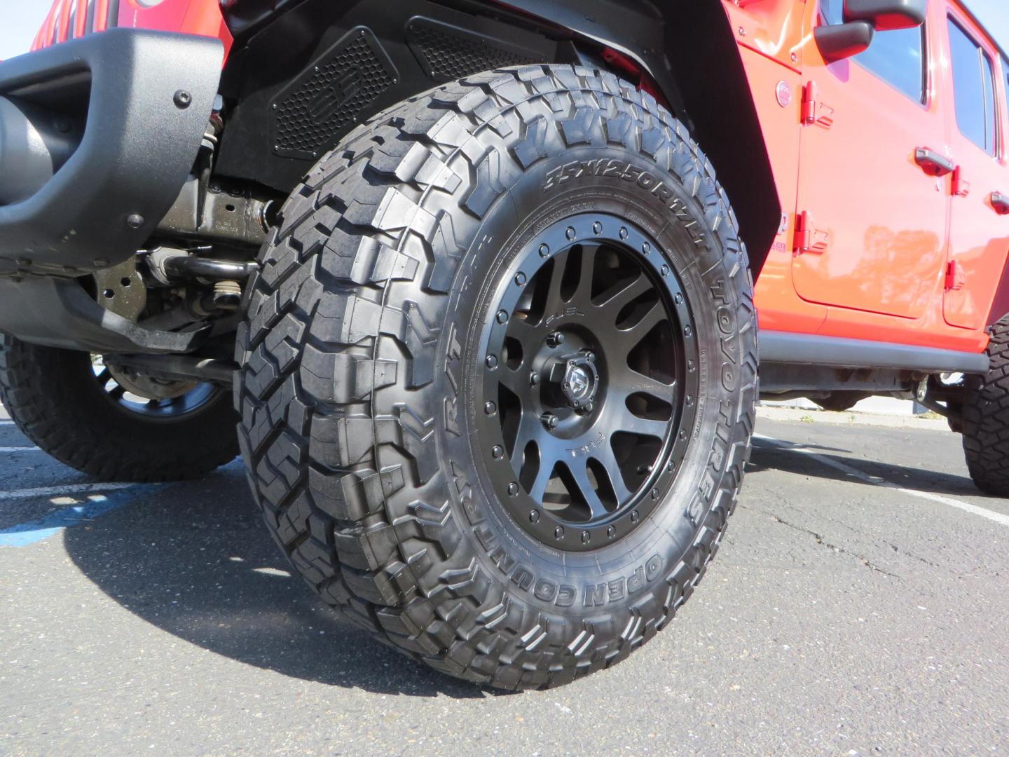 2020 Red /BLACK Jeep Wrangler Unlimited Rubicon (1C4HJXFN8LW) with an 2.0L L4 DOHC 16V TURBO engine, 6A transmission, located at 2630 Grass Valley Highway, Auburn, CA, 95603, (530) 508-5100, 38.937893, -121.095482 - Features - 17'' Fuel Recoil wheels, 35'' Nitto Ridge Grappler tires, Smittybilt XRC Flat fenders, Smittybilt inner fender liners, and new Alea Leather. - Photo#9
