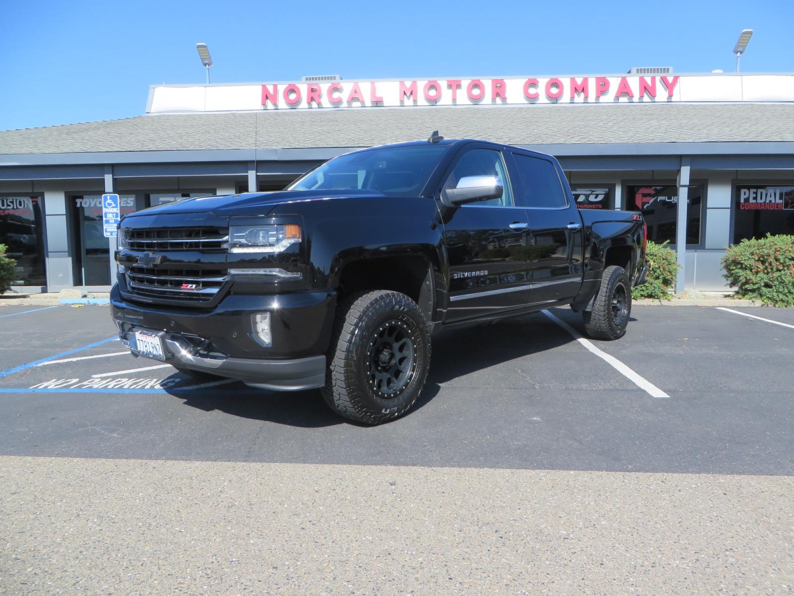 2018 Black /BLACK Chevrolet Silverado 1500 LTZ Crew Cab 4WD (3GCUKSECXJG) with an 5.3L V8 OHV 16V engine, 6A transmission, located at 2630 Grass Valley Highway, Auburn, CA, 95603, (530) 508-5100, 38.937893, -121.095482 - Clean 1500 sitting on a level kit with 17" Method NV wheels wrapped in Falken Wildpeak AT3W tires. - Photo #0