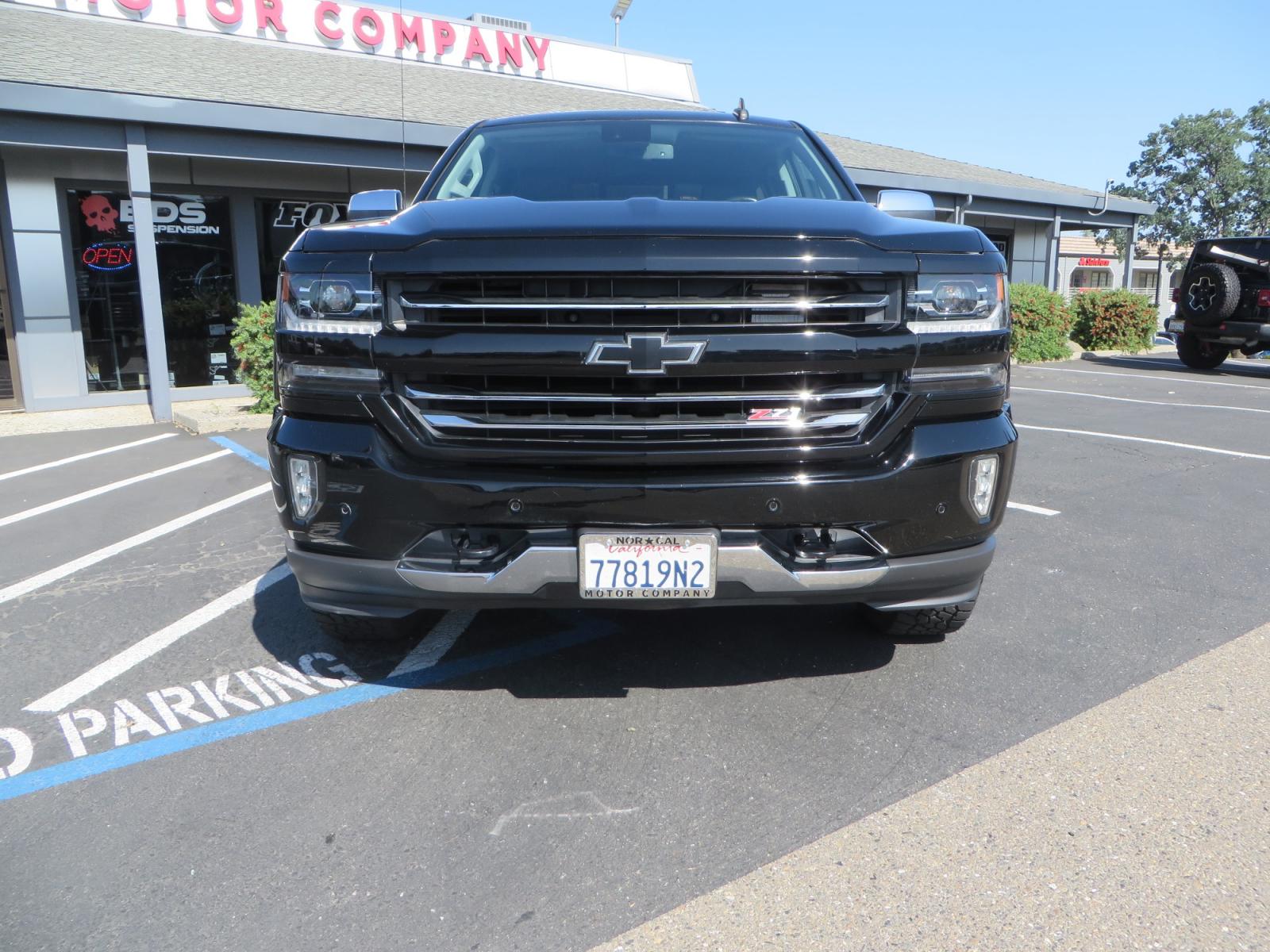 2018 Black /BLACK Chevrolet Silverado 1500 LTZ Crew Cab 4WD (3GCUKSECXJG) with an 5.3L V8 OHV 16V engine, 6A transmission, located at 2630 Grass Valley Highway, Auburn, CA, 95603, (530) 508-5100, 38.937893, -121.095482 - Clean 1500 sitting on a level kit with 17" Method NV wheels wrapped in Falken Wildpeak AT3W tires. - Photo #1