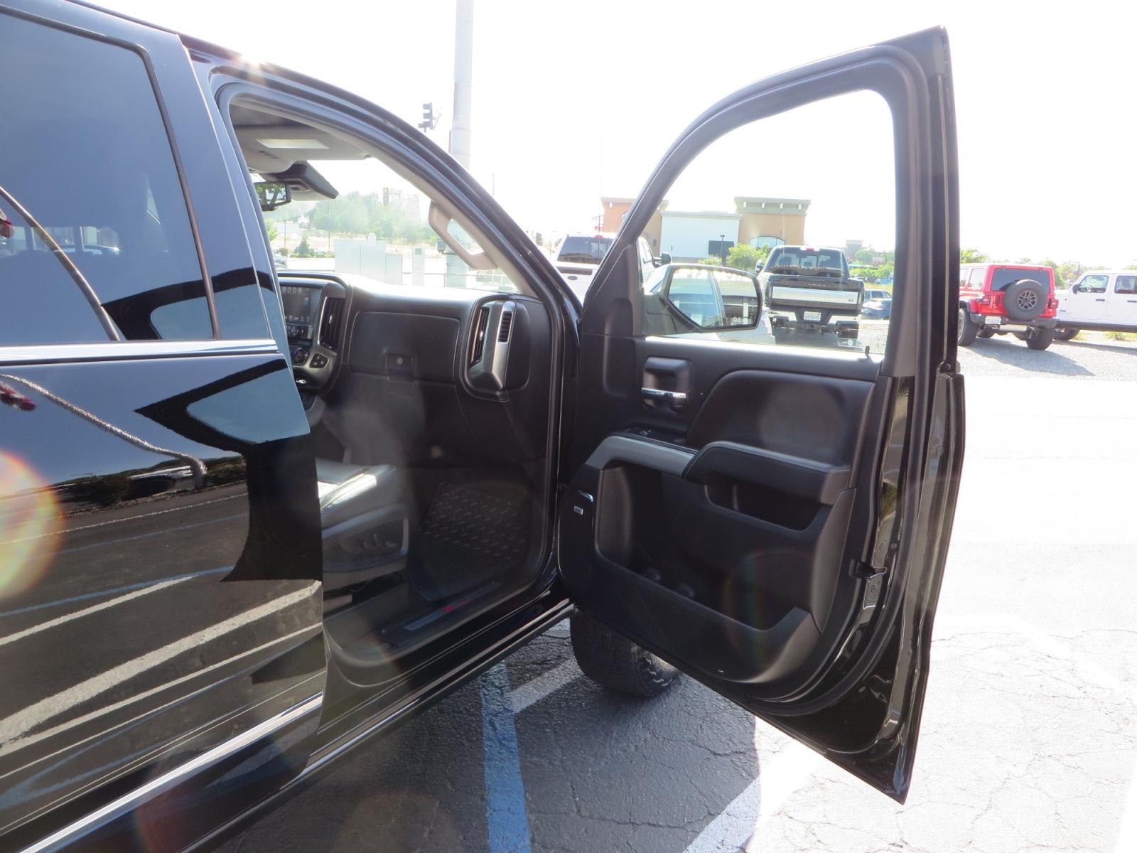 2018 Black /BLACK Chevrolet Silverado 1500 LTZ Crew Cab 4WD (3GCUKSECXJG) with an 5.3L V8 OHV 16V engine, 6A transmission, located at 2630 Grass Valley Highway, Auburn, CA, 95603, (530) 508-5100, 38.937893, -121.095482 - Clean 1500 sitting on a level kit with 17" Method NV wheels wrapped in Falken Wildpeak AT3W tires. - Photo #37