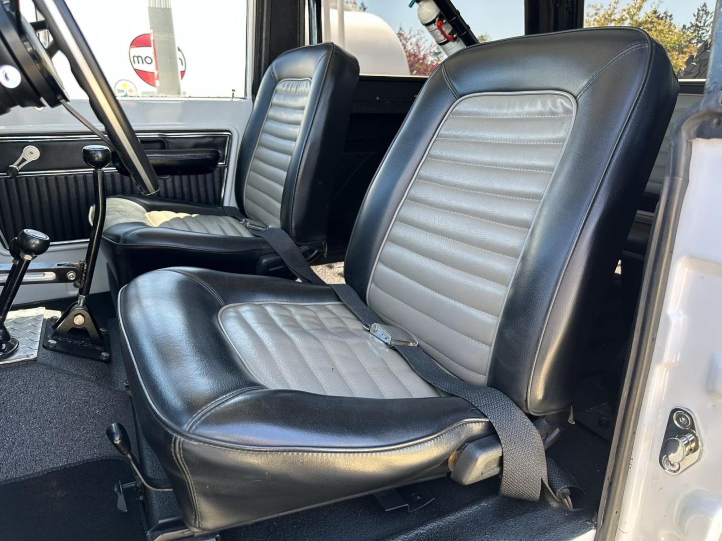 1971 White /Black / Grey Ford Bronco (U15GLK86693) with an 302 engine, np 435 4 speed transmission, located at 2630 Grass Valley Highway, Auburn, CA, 95603, (530) 508-5100, 38.937893, -121.095482 - 1971 FORD BRONCO BUILD CALIFORNIA BRONCO HARD TOP AND NO RUST REBUILT 302 WITH PERFORMANCE CAM, EDELBROCK MANIFOLD, HOLLEY AVENGER 650 CARB & MSD IGNITION NP 435 4 SPEED WITH WILD HORSE BILLET SHIFT EXTENDER DANA 20 WITH WILD HORSE TWIN STICK TRANSFER CASE NEW PAINLESS WIRING HARNESS RHINO LIN - Photo#93