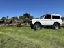 1971 White /Black / Grey Ford Bronco (U15GLK86693) with an 302 engine, np 435 4 speed transmission, located at 2630 Grass Valley Highway, Auburn, CA, 95603, (530) 508-5100, 38.937893, -121.095482 - 1971 FORD BRONCO BUILD CALIFORNIA BRONCO HARD TOP AND NO RUST REBUILT 302 WITH PERFORMANCE CAM, EDELBROCK MANIFOLD, HOLLEY AVENGER 650 CARB & MSD IGNITION NP 435 4 SPEED WITH WILD HORSE BILLET SHIFT EXTENDER DANA 20 WITH WILD HORSE TWIN STICK TRANSFER CASE NEW PAINLESS WIRING HARNESS RHINO LIN - Photo#150