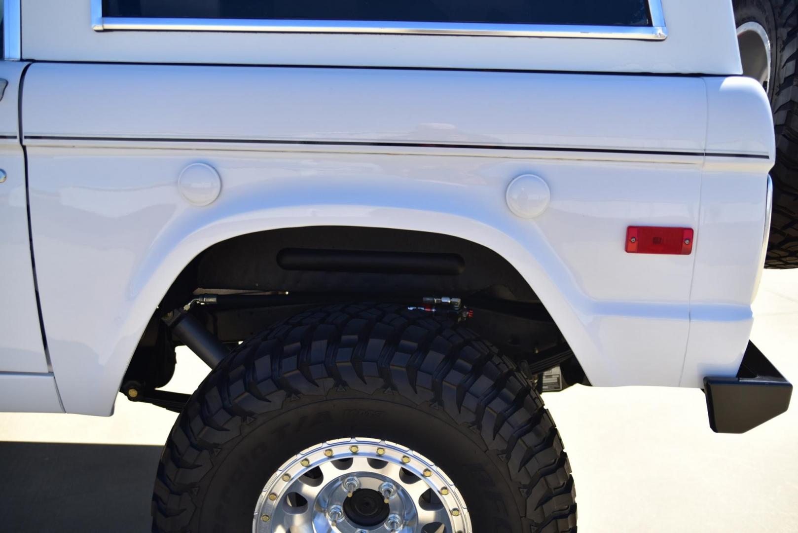 1971 White /Black / Grey Ford Bronco (U15GLK86693) with an 302 engine, np 435 4 speed transmission, located at 2630 Grass Valley Highway, Auburn, CA, 95603, (530) 508-5100, 38.937893, -121.095482 - 1971 FORD BRONCO BUILD CALIFORNIA BRONCO HARD TOP AND NO RUST REBUILT 302 WITH PERFORMANCE CAM, EDELBROCK MANIFOLD, HOLLEY AVENGER 650 CARB & MSD IGNITION NP 435 4 SPEED WITH WILD HORSE BILLET SHIFT EXTENDER DANA 20 WITH WILD HORSE TWIN STICK TRANSFER CASE NEW PAINLESS WIRING HARNESS RHINO LIN - Photo#218