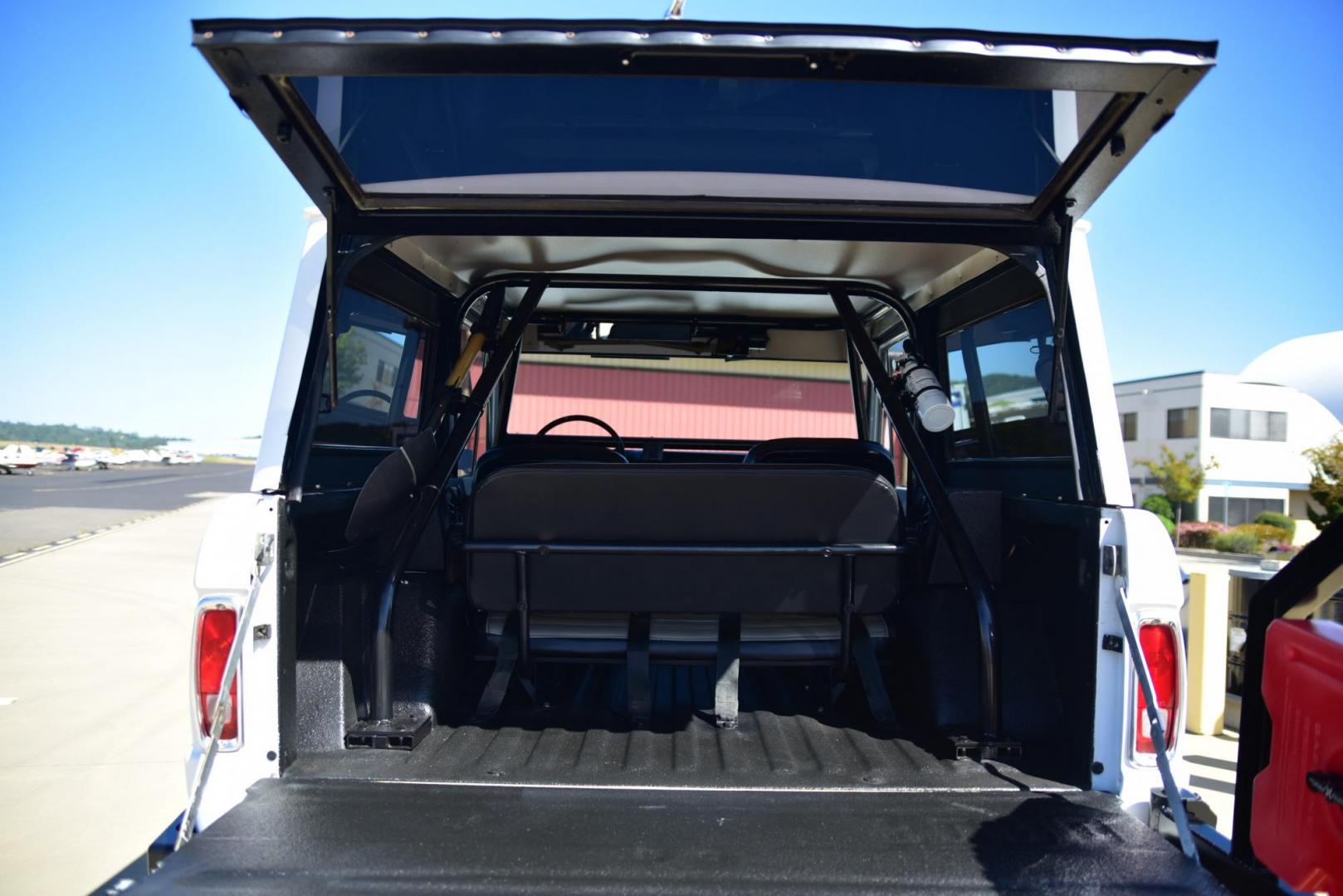 1971 White /Black / Grey Ford Bronco (U15GLK86693) with an 302 engine, np 435 4 speed transmission, located at 2630 Grass Valley Highway, Auburn, CA, 95603, (530) 508-5100, 38.937893, -121.095482 - 1971 FORD BRONCO BUILD CALIFORNIA BRONCO HARD TOP AND NO RUST REBUILT 302 WITH PERFORMANCE CAM, EDELBROCK MANIFOLD, HOLLEY AVENGER 650 CARB & MSD IGNITION NP 435 4 SPEED WITH WILD HORSE BILLET SHIFT EXTENDER DANA 20 WITH WILD HORSE TWIN STICK TRANSFER CASE NEW PAINLESS WIRING HARNESS RHINO LIN - Photo#292
