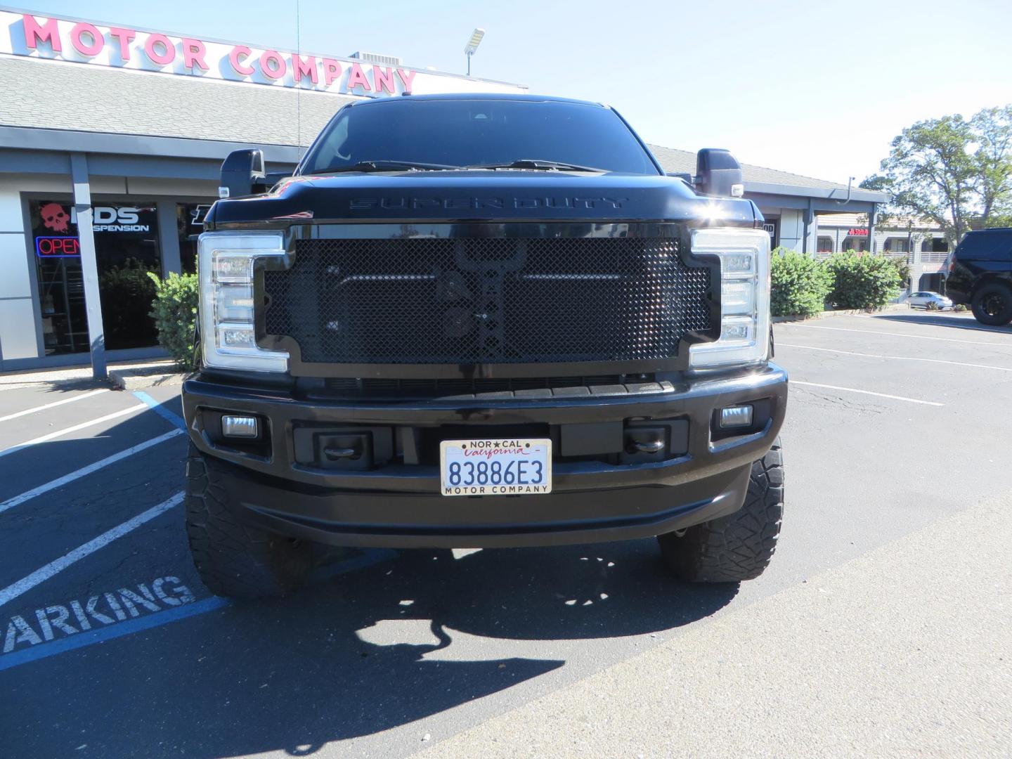2017 BLACK Ford F-250 SD Platinum Crew Cab Short Bed 4WD (1FT7W2BT0HE) with an 6.7L V8 OHV 16V DIESEL engine, 6A transmission, located at 2630 Grass Valley Highway, Auburn, CA, 95603, (530) 508-5100, 38.937893, -121.095482 - Lifted F-250 featuring a SkyJacker long arm suspension system, Fox 2.5 remote reservoir coilovers, Fox 2.0 rear remote reservoir shocks, Fox dual steering stabilizers, 20" XD wheels, 37" Nitto Ridge Grappler tires, Racer X Mesh Grille, Airlift Air Bags, Painted badges, and window tint. - Photo#1