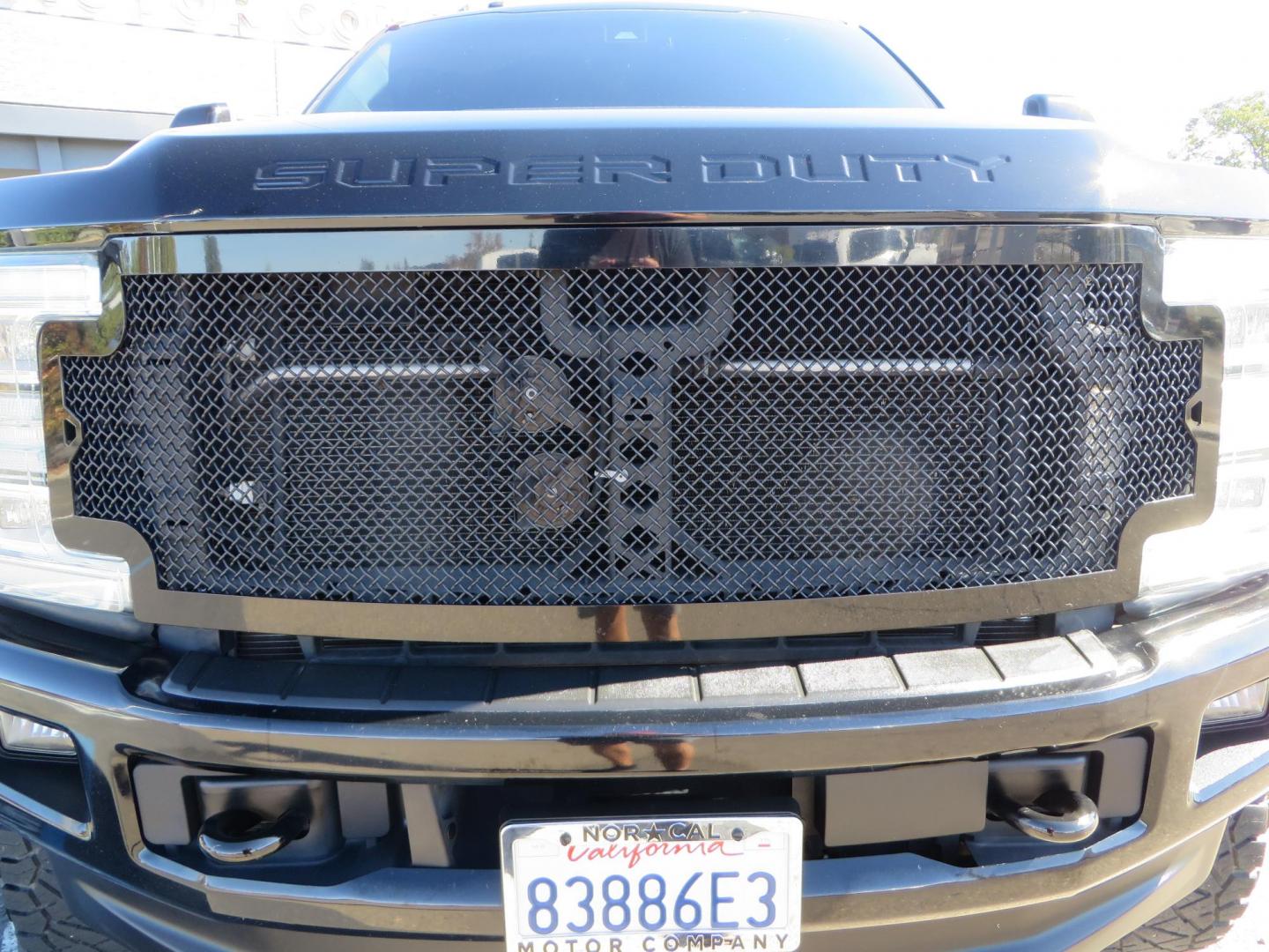 2017 BLACK Ford F-250 SD Platinum Crew Cab Short Bed 4WD (1FT7W2BT0HE) with an 6.7L V8 OHV 16V DIESEL engine, 6A transmission, located at 2630 Grass Valley Highway, Auburn, CA, 95603, (530) 508-5100, 38.937893, -121.095482 - Lifted F-250 featuring a SkyJacker long arm suspension system, Fox 2.5 remote reservoir coilovers, Fox 2.0 rear remote reservoir shocks, Fox dual steering stabilizers, 20" XD wheels, 37" Nitto Ridge Grappler tires, Racer X Mesh Grille, Airlift Air Bags, Painted badges, and window tint. - Photo#12