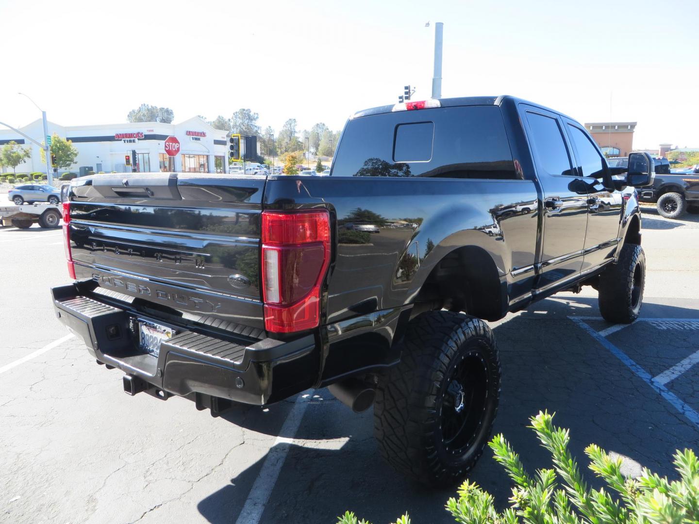 2017 BLACK Ford F-250 SD Platinum Crew Cab Short Bed 4WD (1FT7W2BT0HE) with an 6.7L V8 OHV 16V DIESEL engine, 6A transmission, located at 2630 Grass Valley Highway, Auburn, CA, 95603, (530) 508-5100, 38.937893, -121.095482 - Lifted F-250 featuring a SkyJacker long arm suspension system, Fox 2.5 remote reservoir coilovers, Fox 2.0 rear remote reservoir shocks, Fox dual steering stabilizers, 20" XD wheels, 37" Nitto Ridge Grappler tires, Racer X Mesh Grille, Airlift Air Bags, Painted badges, and window tint. - Photo#4