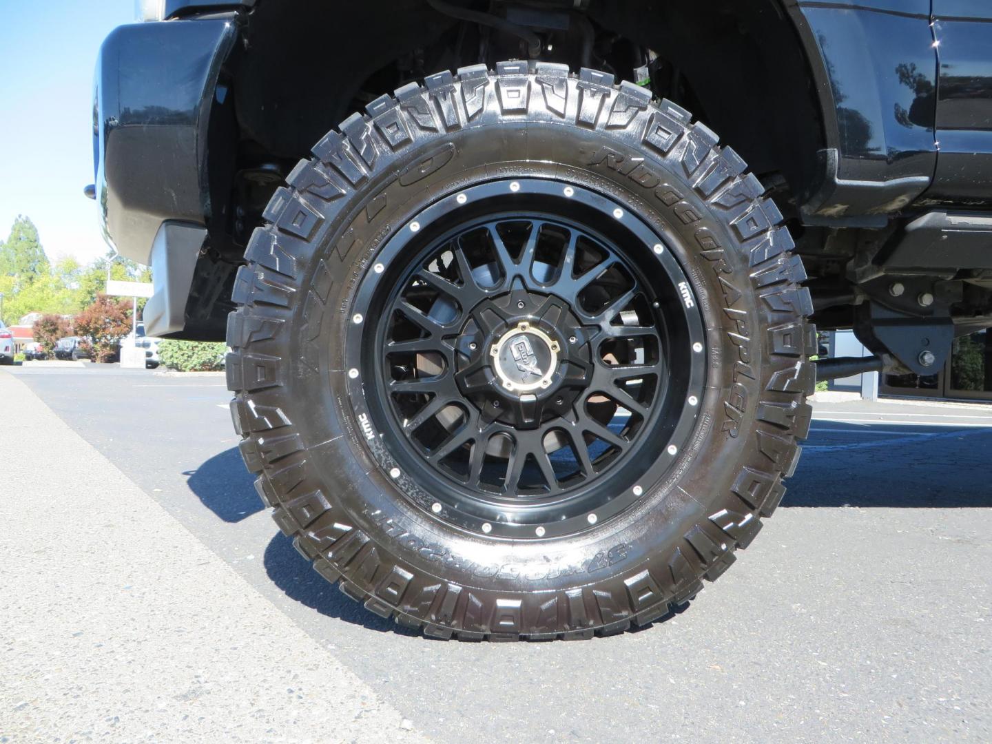 2017 BLACK Ford F-250 SD Platinum Crew Cab Short Bed 4WD (1FT7W2BT0HE) with an 6.7L V8 OHV 16V DIESEL engine, 6A transmission, located at 2630 Grass Valley Highway, Auburn, CA, 95603, (530) 508-5100, 38.937893, -121.095482 - Lifted F-250 featuring a SkyJacker long arm suspension system, Fox 2.5 remote reservoir coilovers, Fox 2.0 rear remote reservoir shocks, Fox dual steering stabilizers, 20" XD wheels, 37" Nitto Ridge Grappler tires, Racer X Mesh Grille, Airlift Air Bags, Painted badges, and window tint. - Photo#8