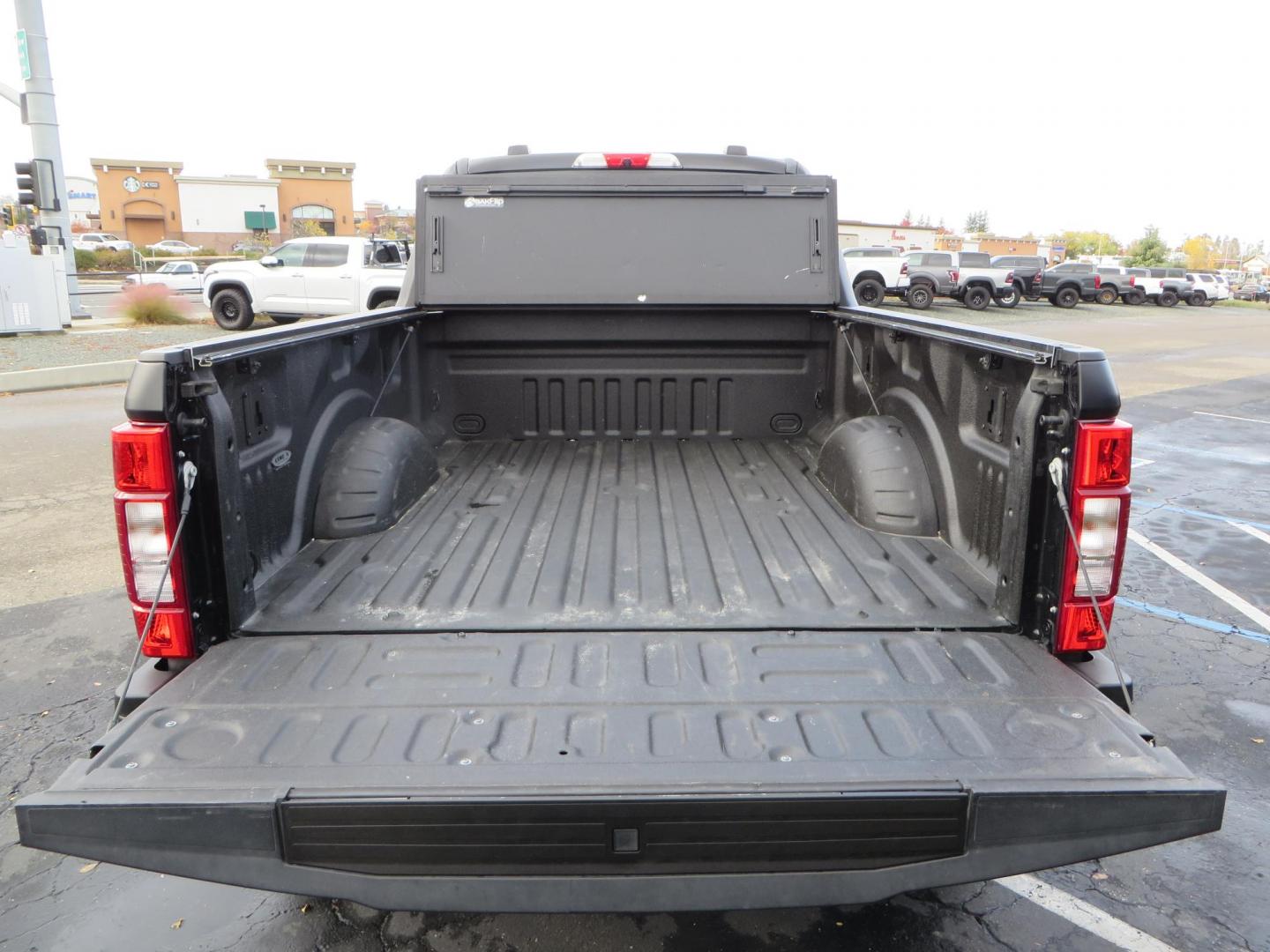 2022 BLACK /BLACK Ford F-250 SD Lariat Crew Cab 4WD (1FT7W2BT5NE) with an 6.7L V8 OHV 16V DIESEL engine, 6A transmission, located at 2630 Grass Valley Highway, Auburn, CA, 95603, (530) 508-5100, 38.937893, -121.095482 - Lifted Superduty sitting on top of a Superlift suspension system with King Coil-overs, King Remote reservoir rear shocks, 37" Mickey Thompson Baja Boss tires, 20" Fuel Covert wheels, Morimoto headlights, Bakflip bed cover, AMP bedstep, Window tint, and Matte Black Paint. - Photo#19