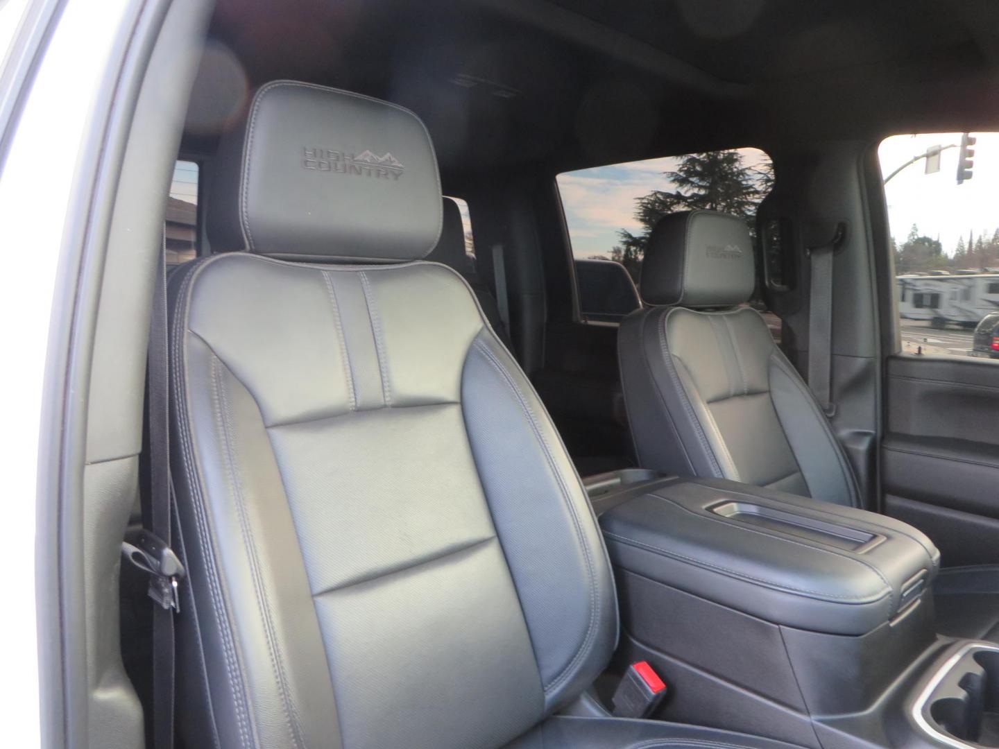 2022 White /Black Chevrolet Silverado 3500HD High Country Crew Cab 4WD (1GC4YVEY0NF) with an 6.6L V8 OHV 32V TURBO DIESEL engine, 6A transmission, located at 2630 Grass Valley Highway, Auburn, CA, 95603, (530) 508-5100, 38.937893, -121.095482 - Must see High Country Dually featuring a CST lift kit, 20" DDC wheels, Toyo Open Country RT Trail tires, Road Armor front and rear bumpers, Road Armor 12k Winch, Westin LED lights, and Window tint. - Photo#66