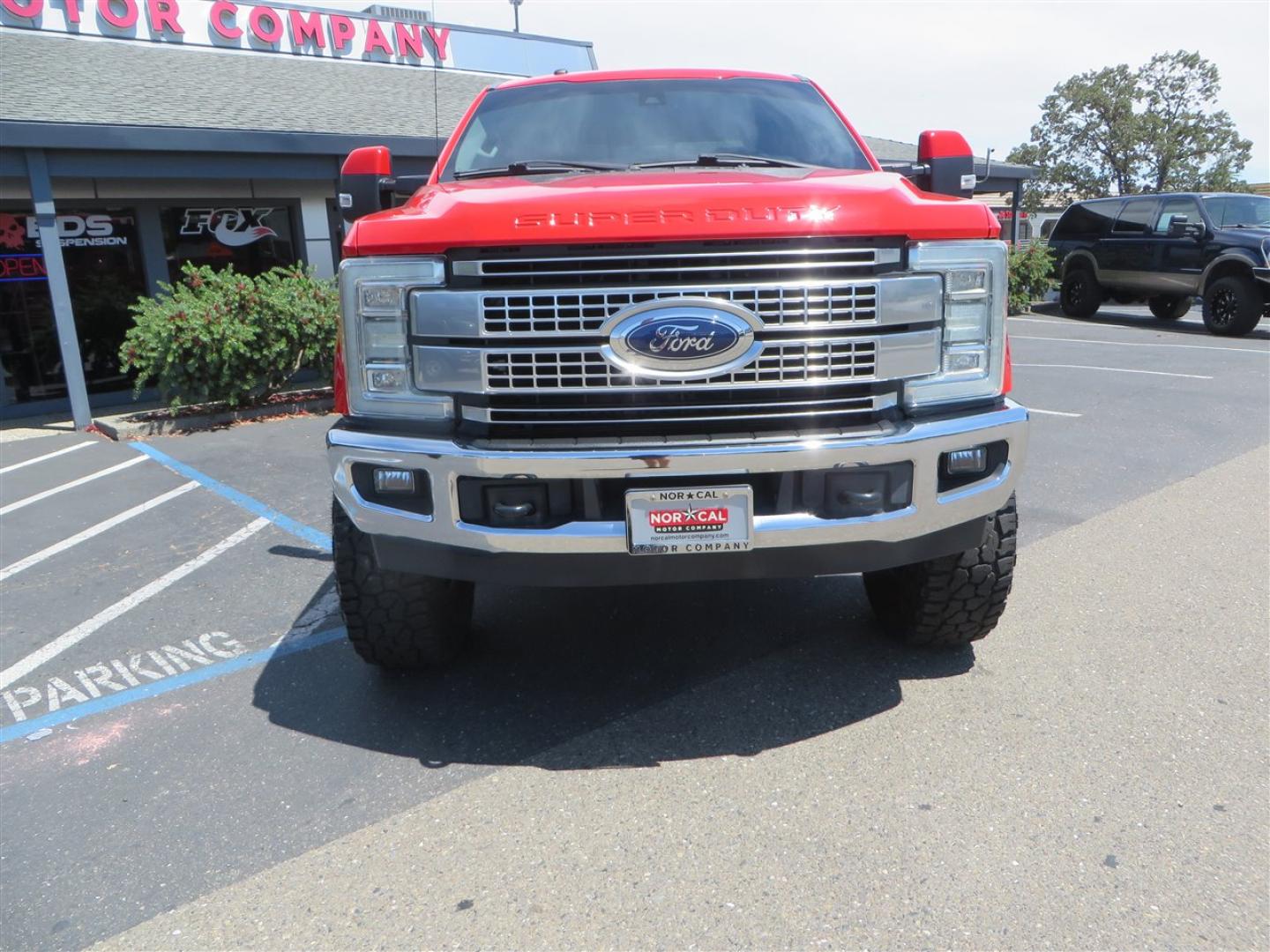 2017 Red Ford F-250 SD Lariat Crew Cab Long Bed 4WD (1FT7W2BT7HE) with an 6.7L V8 OHV 16V DIESEL engine, 6A transmission, located at 2630 Grass Valley Highway, Auburn, CA, 95603, (530) 508-5100, 38.937893, -121.095482 - Super Clean Lariat Superduty sitting on Carli Pintop suspension system, King 2.5 remote reservoir shocks, Radius Arms, High Mount stabilizer, Torsion Sway bar, and Deaver rear leaf springs, 38" Falken Wildpeak RT tires, 17" Method 315 wheels , and window tint. - Photo#1