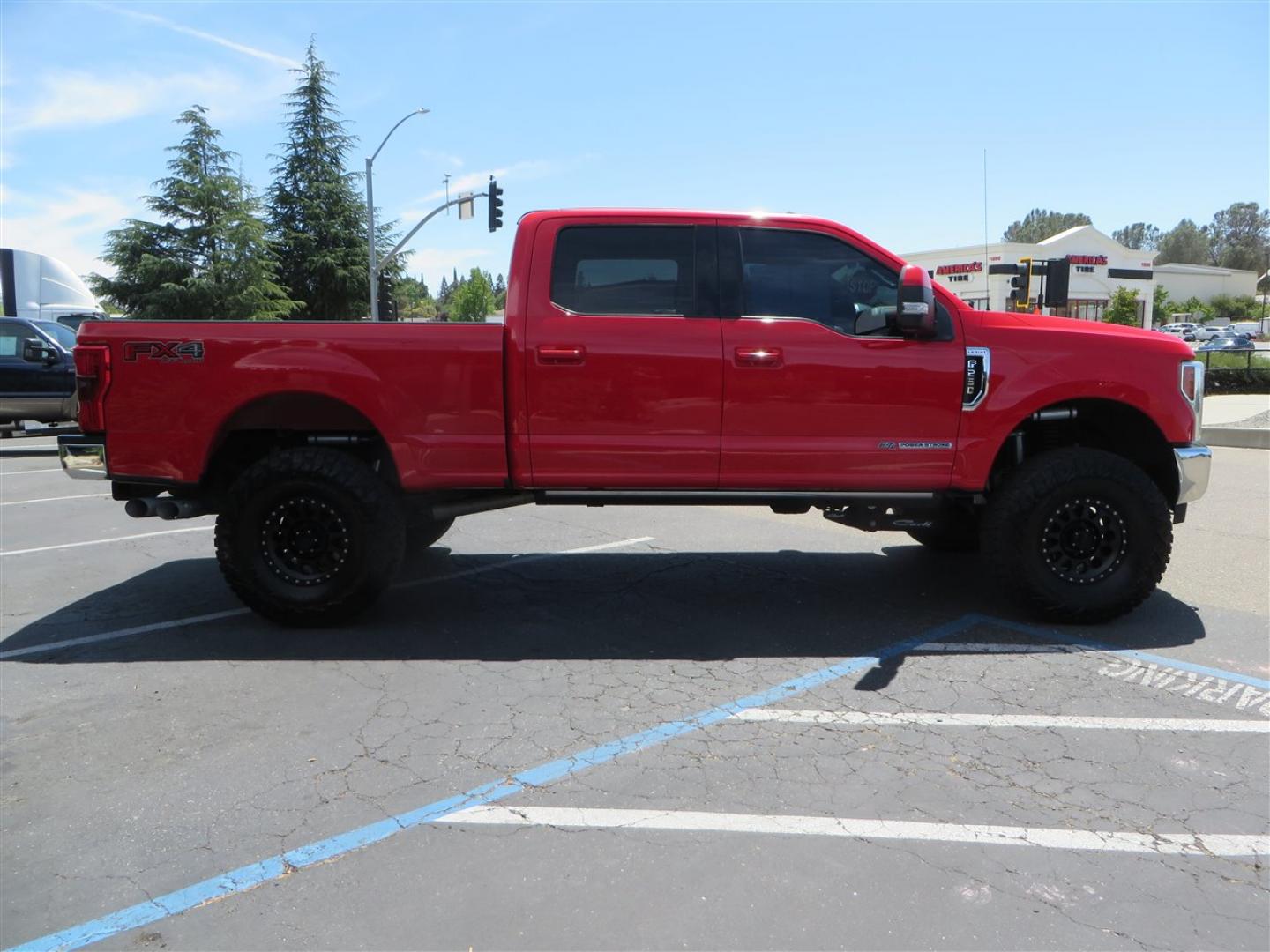 2017 Red Ford F-250 SD Lariat Crew Cab Long Bed 4WD (1FT7W2BT7HE) with an 6.7L V8 OHV 16V DIESEL engine, 6A transmission, located at 2630 Grass Valley Highway, Auburn, CA, 95603, (530) 508-5100, 38.937893, -121.095482 - Super Clean Lariat Superduty sitting on Carli Pintop suspension system, King 2.5 remote reservoir shocks, Radius Arms, High Mount stabilizer, Torsion Sway bar, and Deaver rear leaf springs, 38" Falken Wildpeak RT tires, 17" Method 315 wheels , and window tint. - Photo#3
